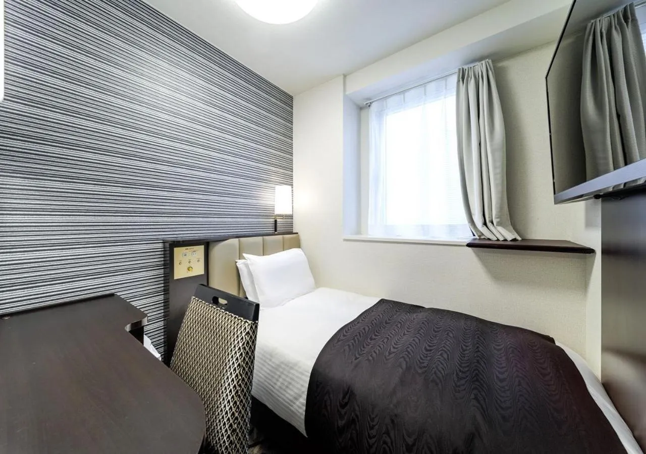 Photo of the whole room, Bed in APA Hotel Miyazaki Nobeoka Ekimae