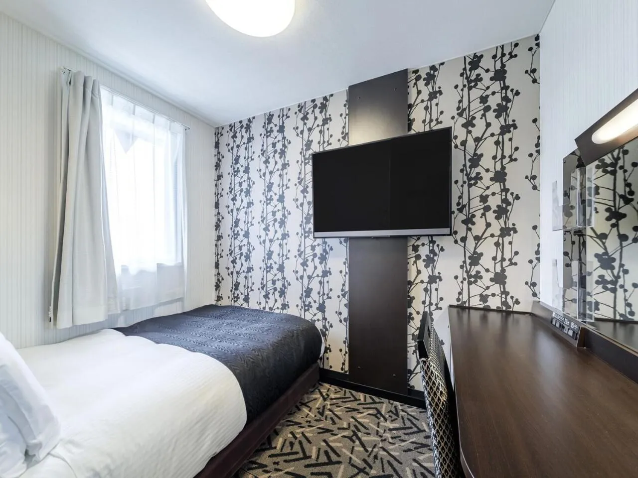 Photo of the whole room, Bed in APA Hotel Miyazaki Nobeoka Ekimae