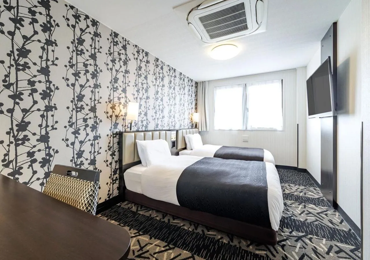 Photo of the whole room, Bed in APA Hotel Miyazaki Nobeoka Ekimae