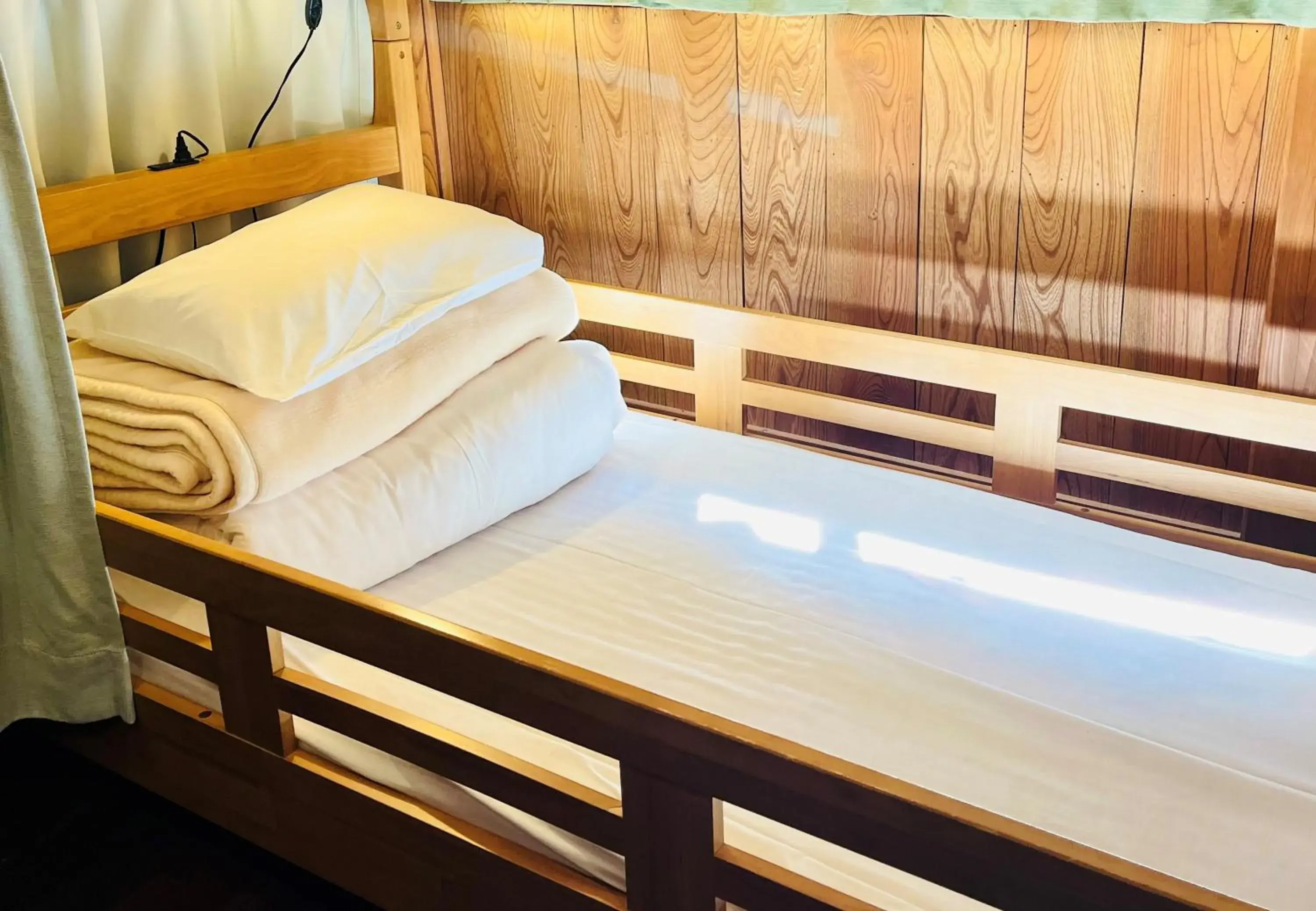 Bed in Male Dormitory Room in Minsyuku Koshiyama Bed in Male Dormitory Room in Minsyuku Koshiyama