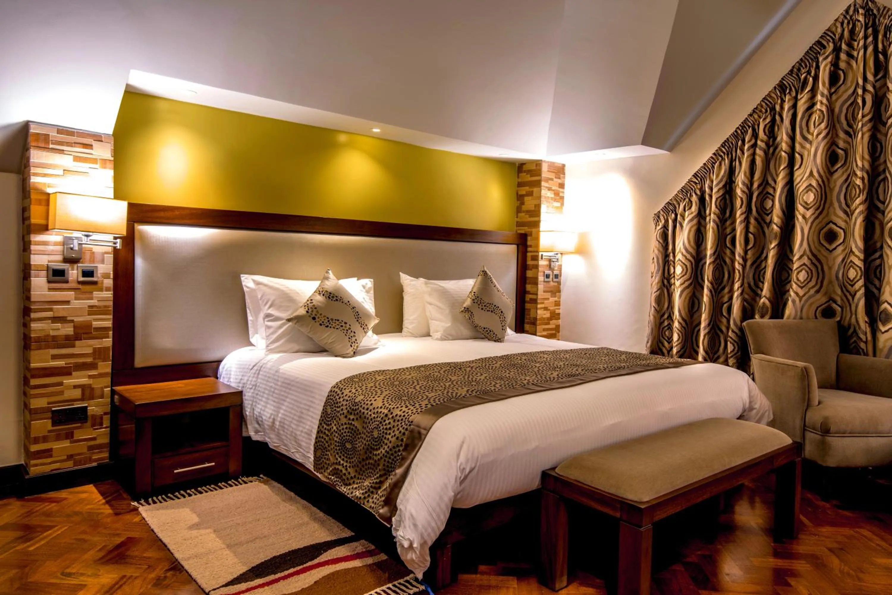 Bed in Magna Hotel and Suites