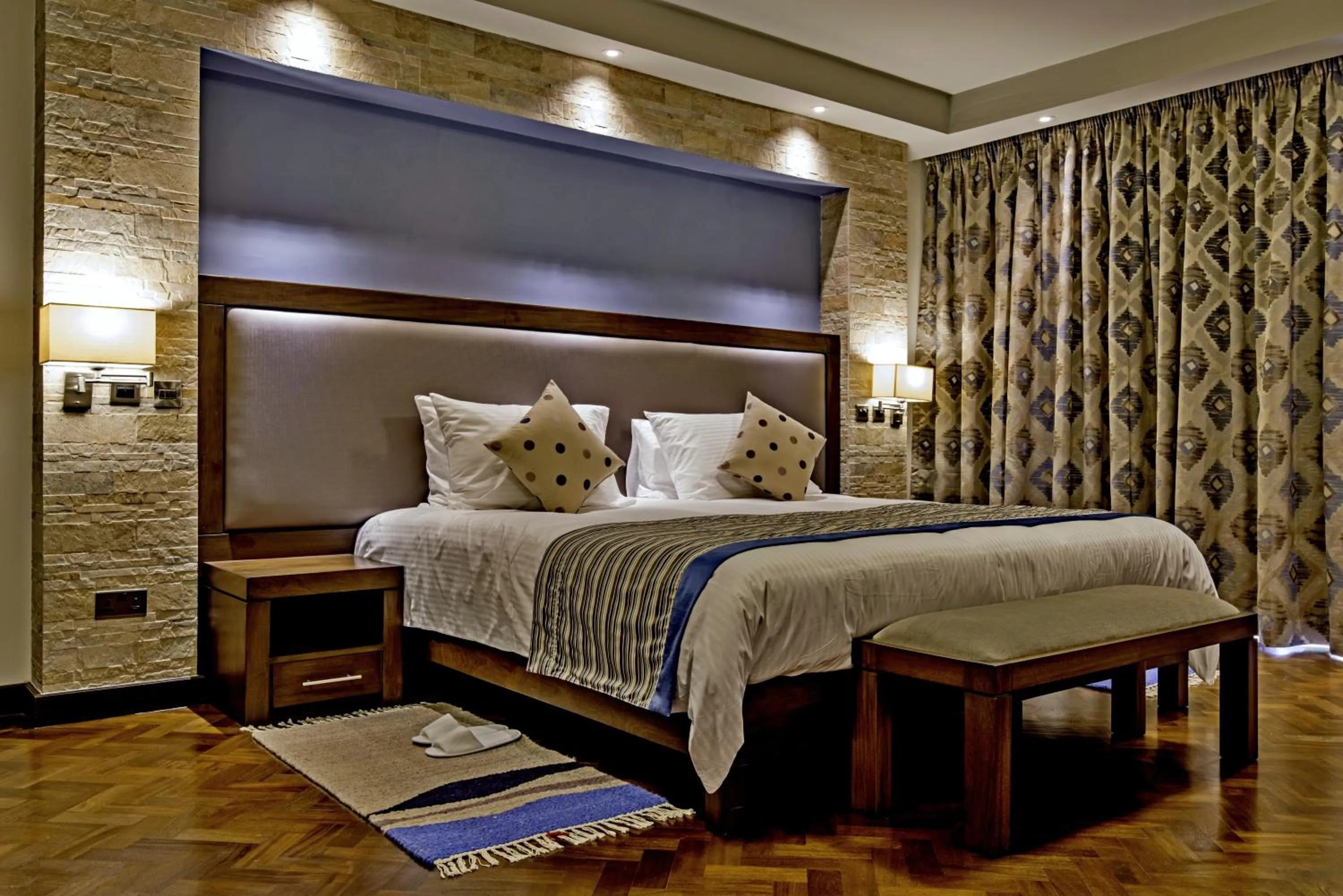 Bed in Magna Hotel and Suites