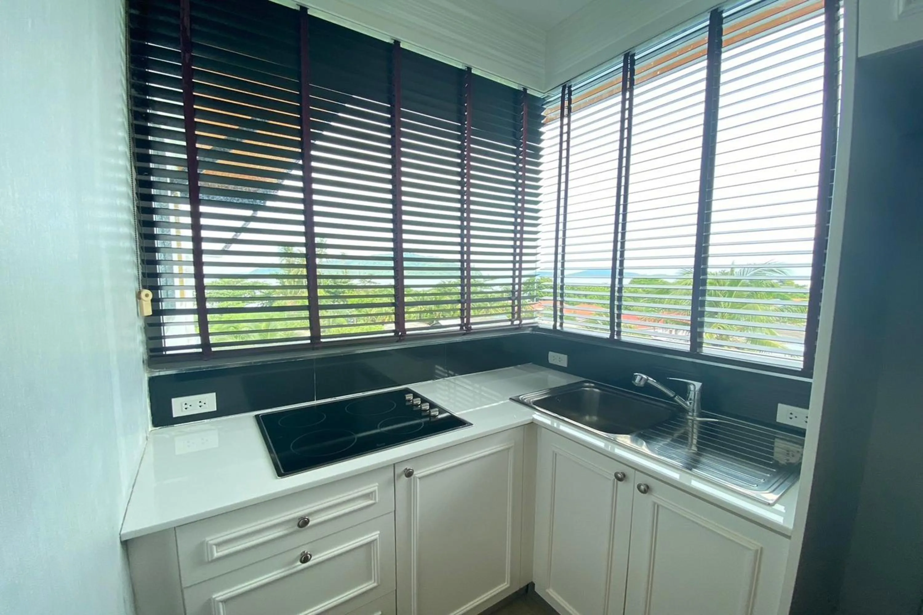 Kitchen or kitchenette in Aqua Resort Phuket - Near Beach and Chalong Pier