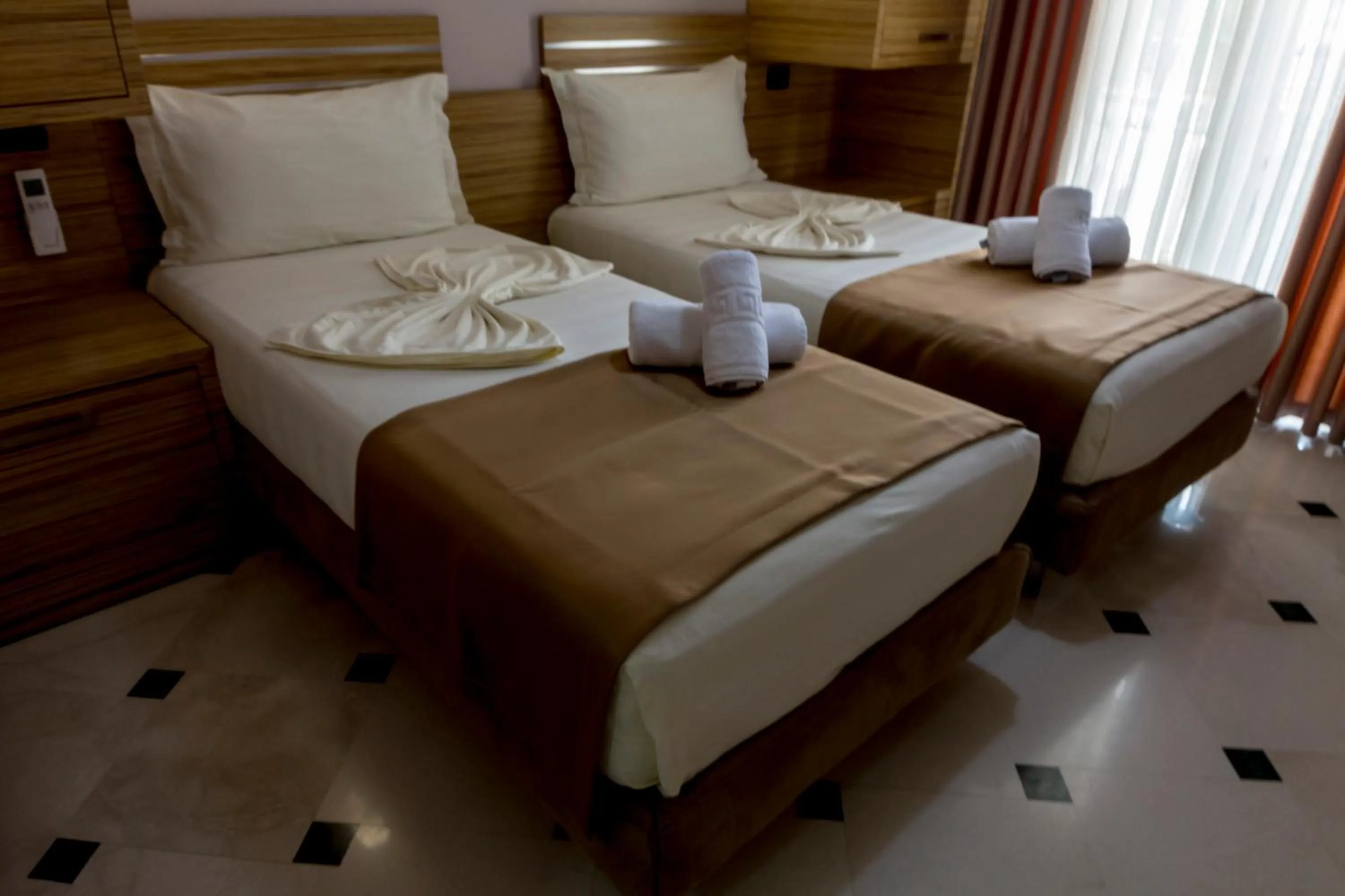 Bed in Hotel Pandora Residence