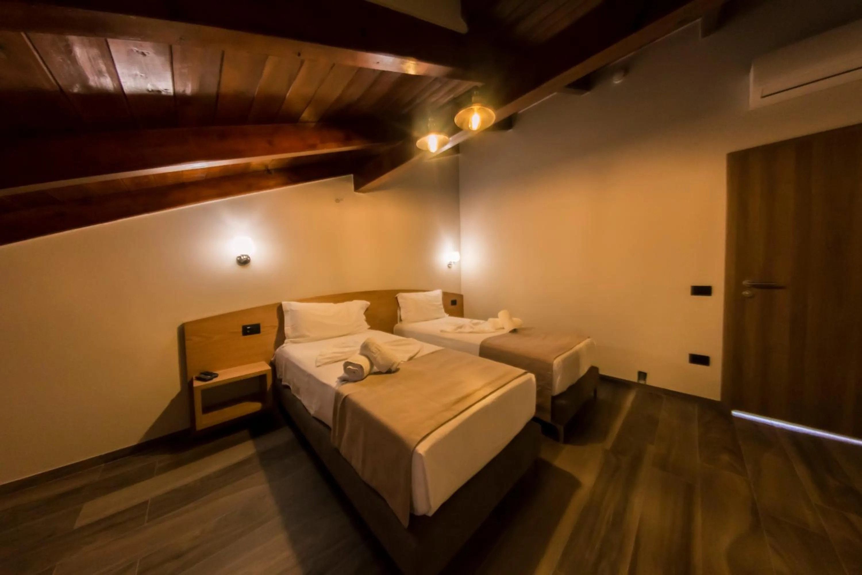 Bed in Hotel Pandora Residence