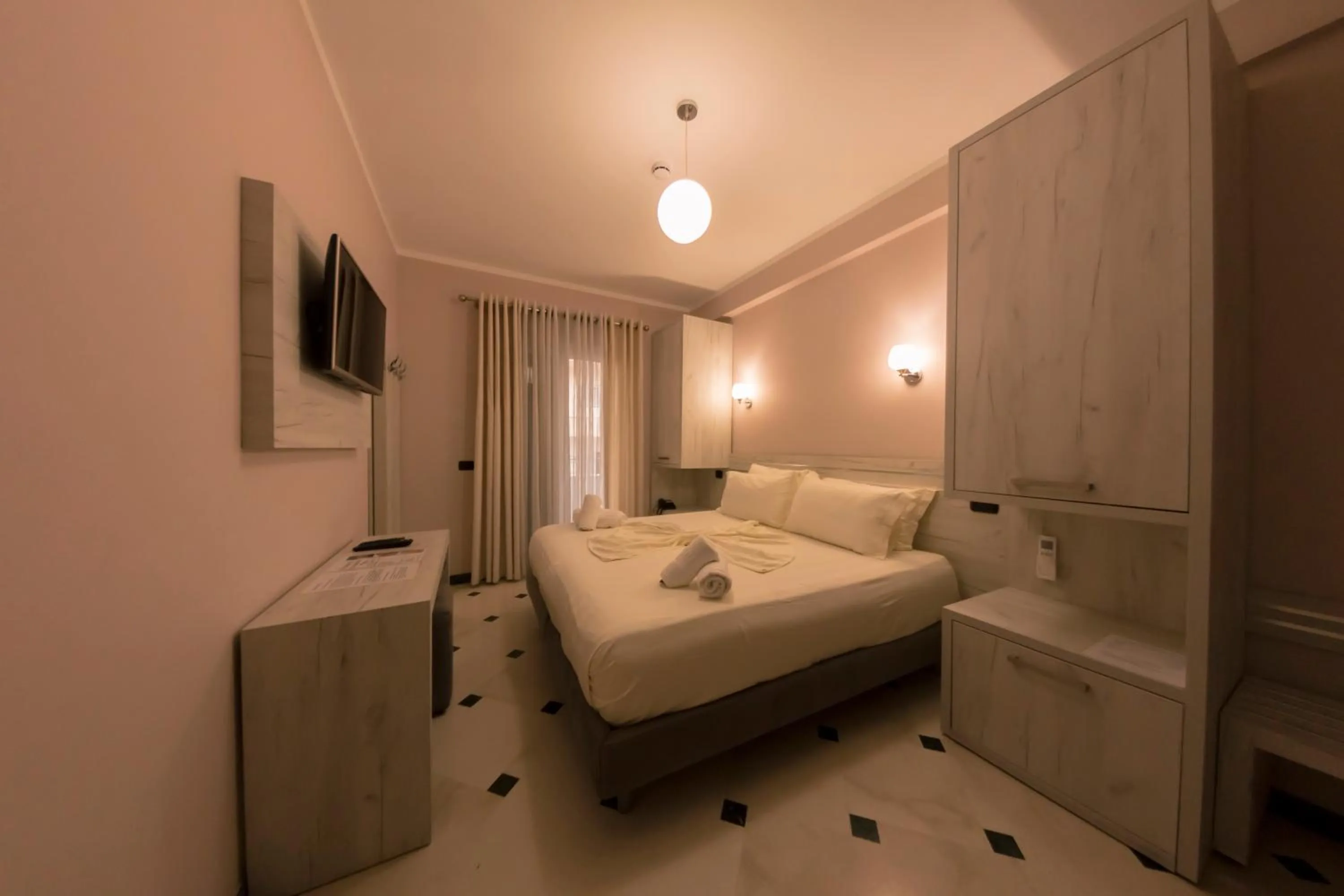 Bed in Hotel Pandora Residence