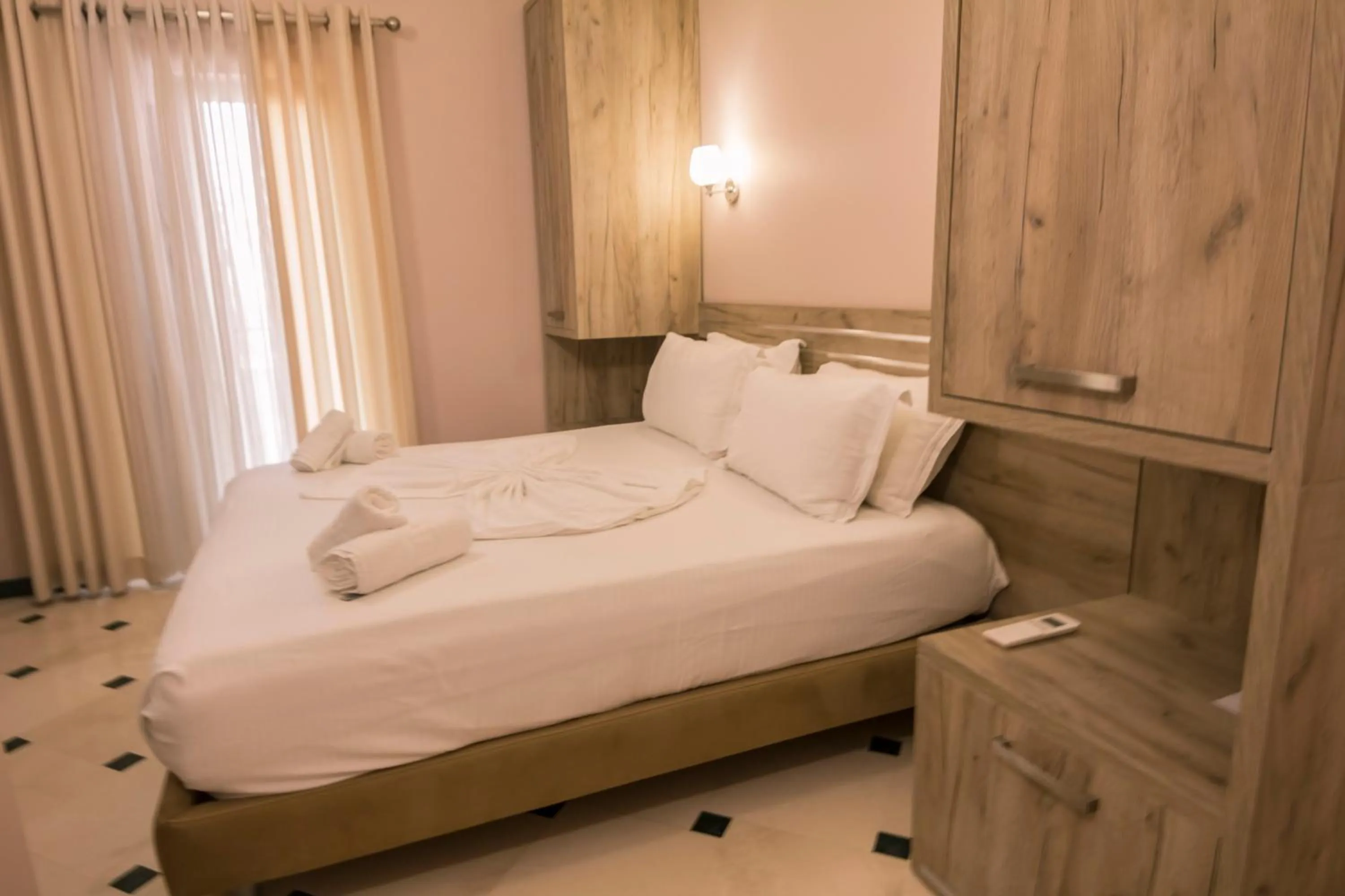 Bed in Hotel Pandora Residence