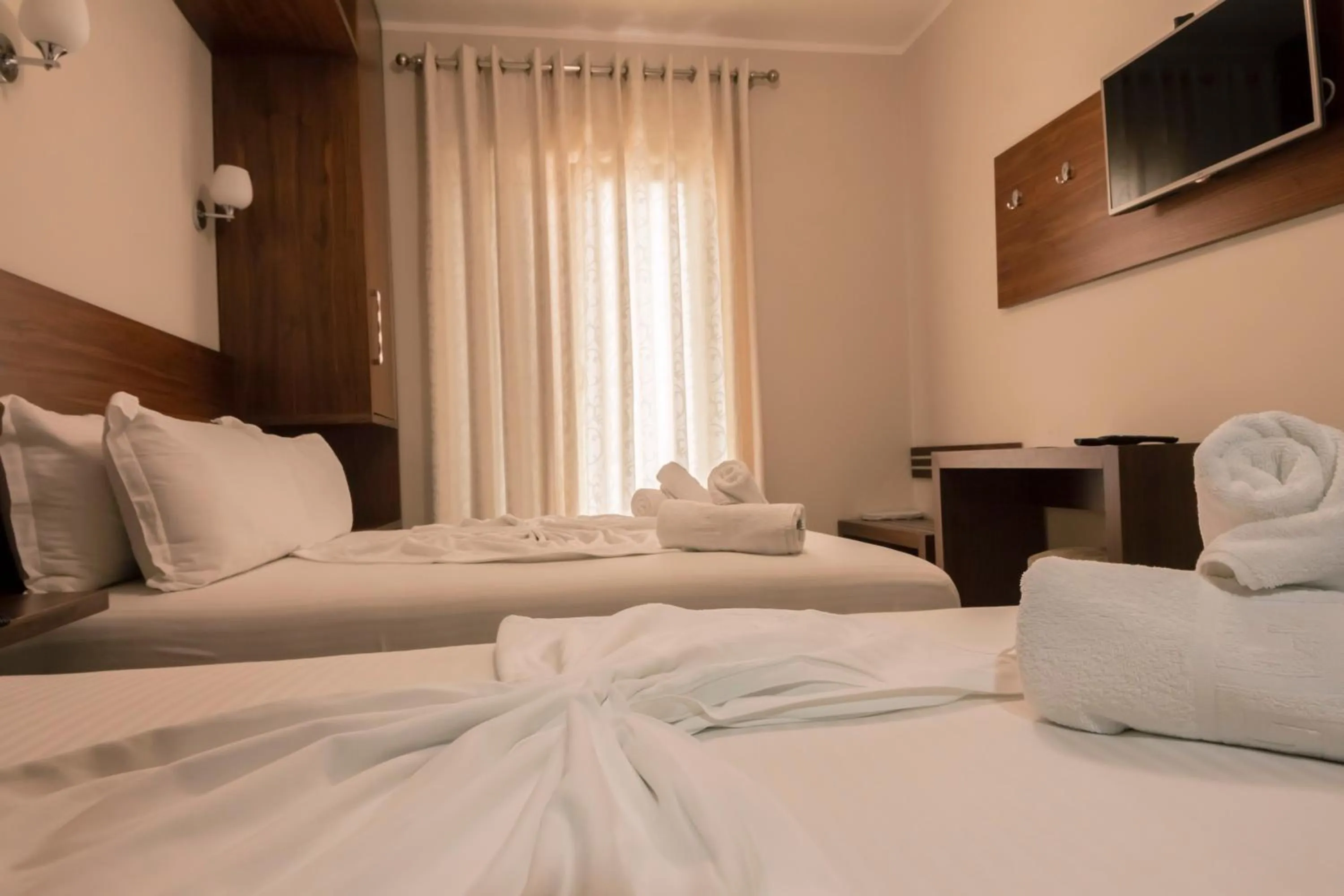 Bed in Hotel Pandora Residence