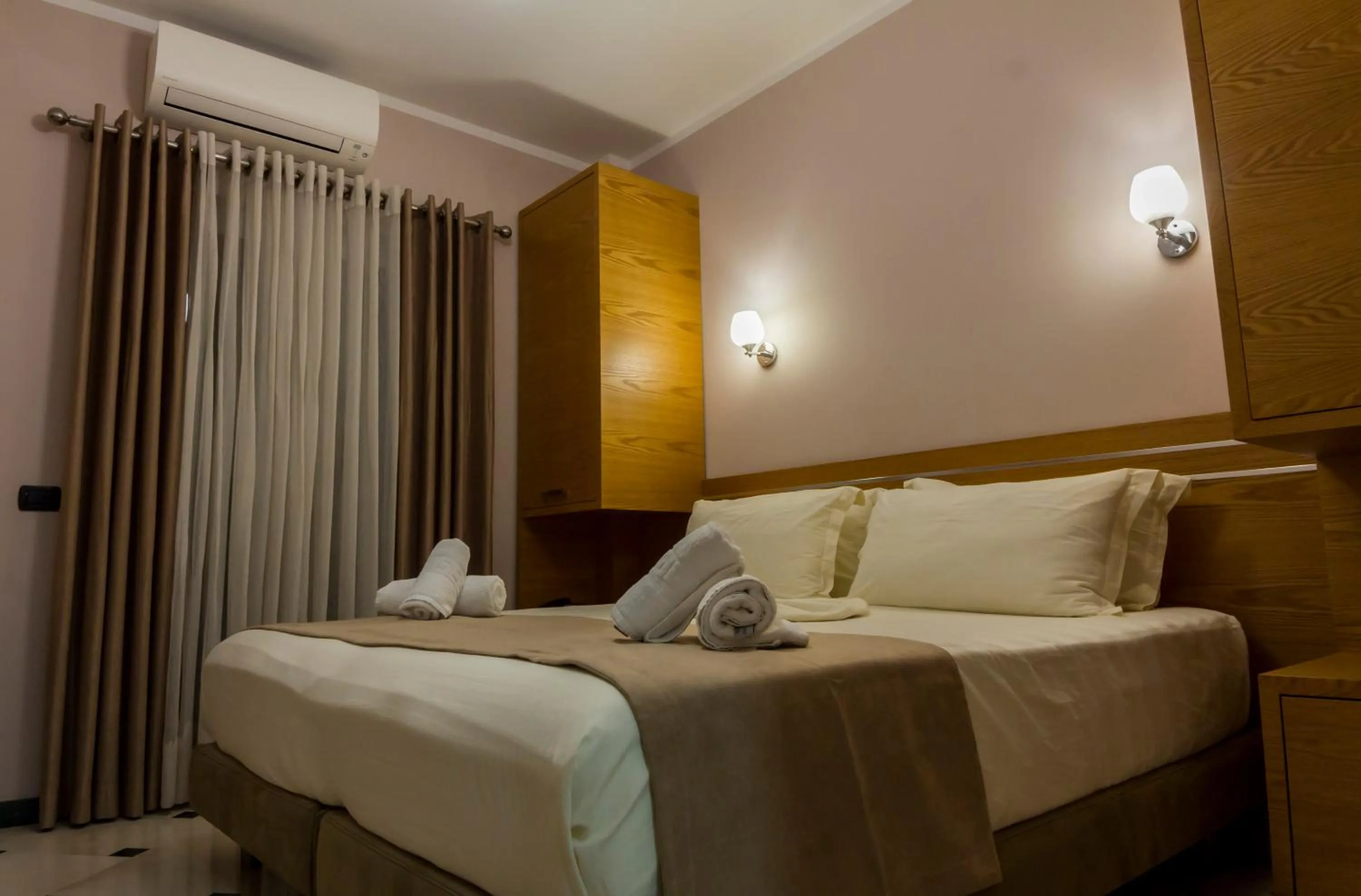 Bed in Hotel Pandora Residence