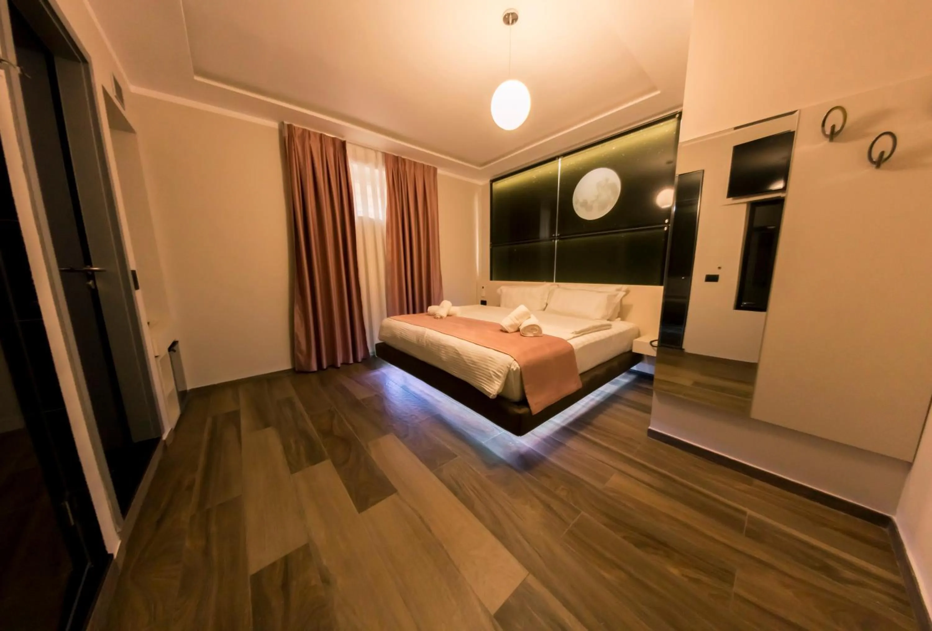 Bed in Hotel Pandora Residence