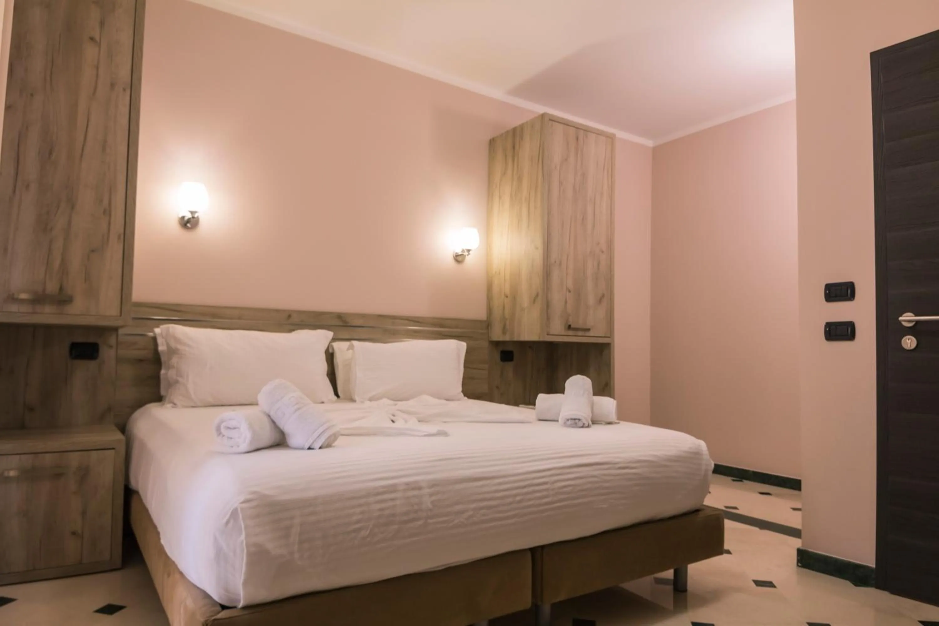 Bed in Hotel Pandora Residence