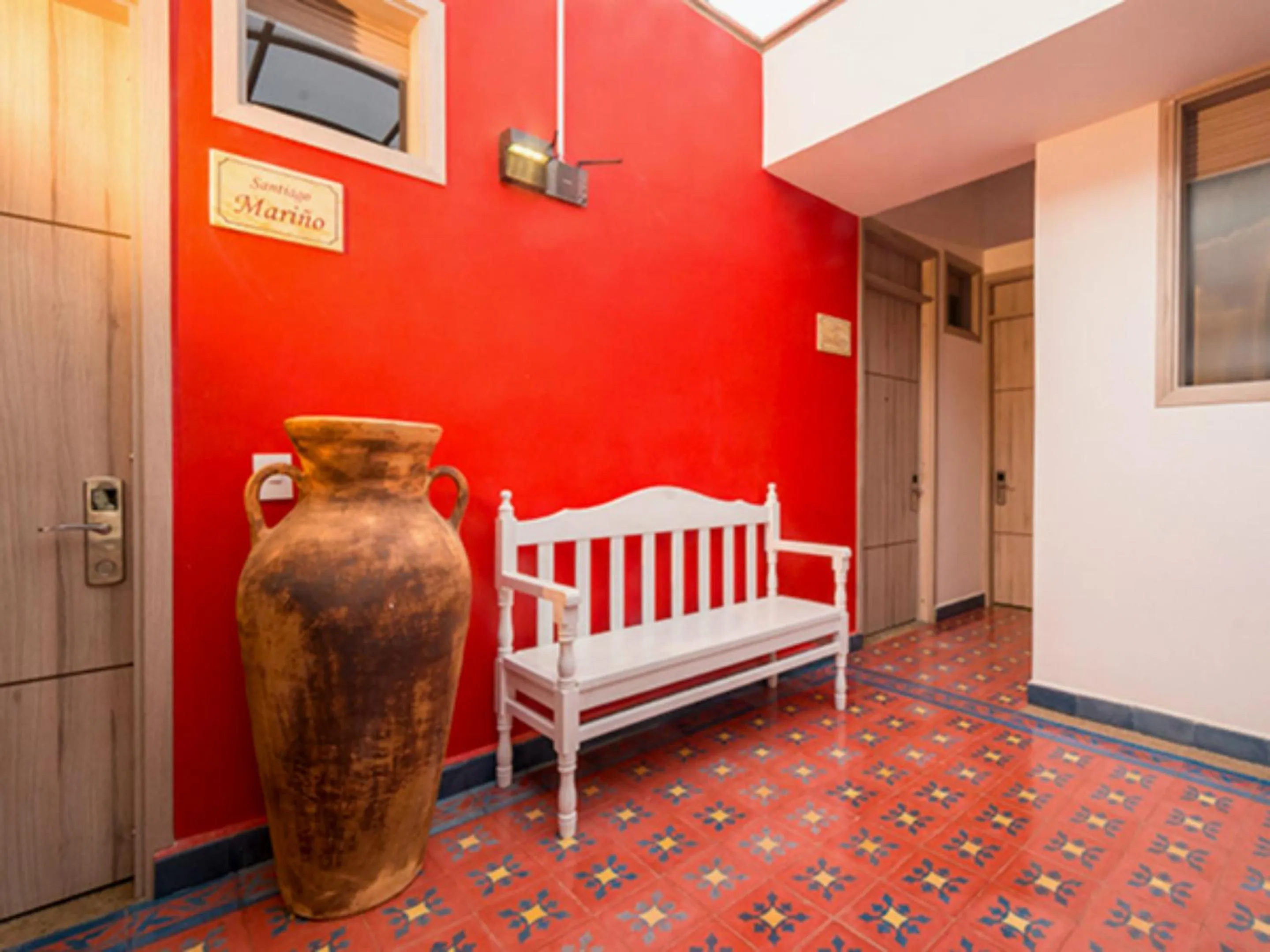 Communal lounge/ TV room, Bed in Hotel Capitan Ricaurte