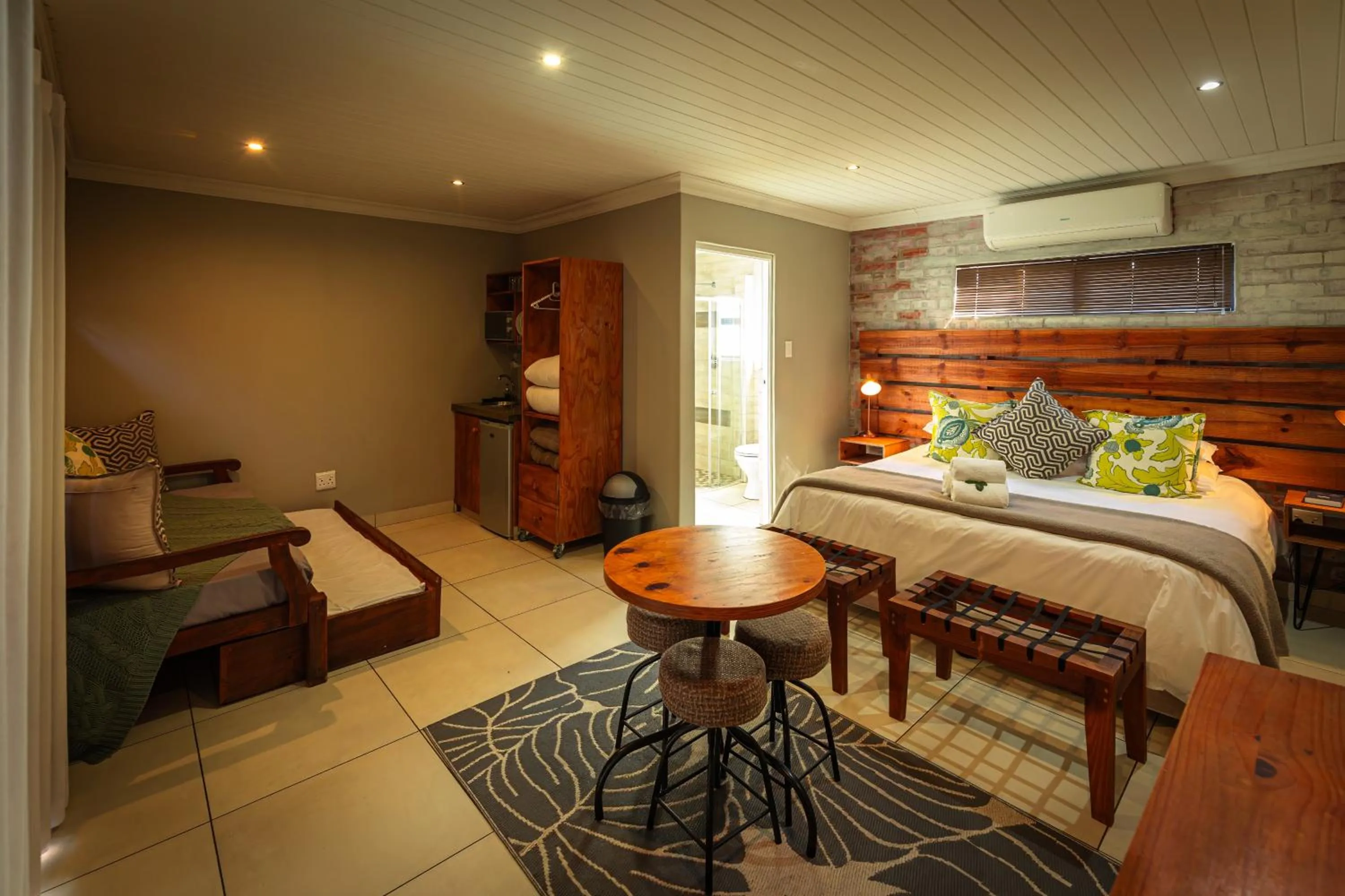 Seating area, Bed in Telos at Reitz