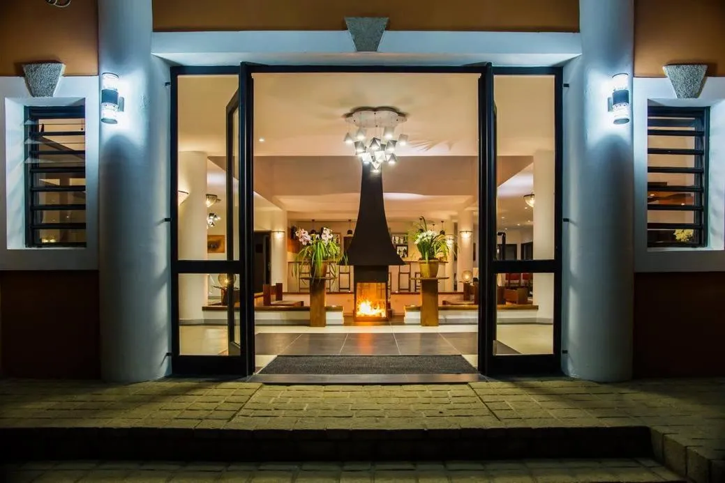 Communal lounge/ TV room in Plumeria Hotel