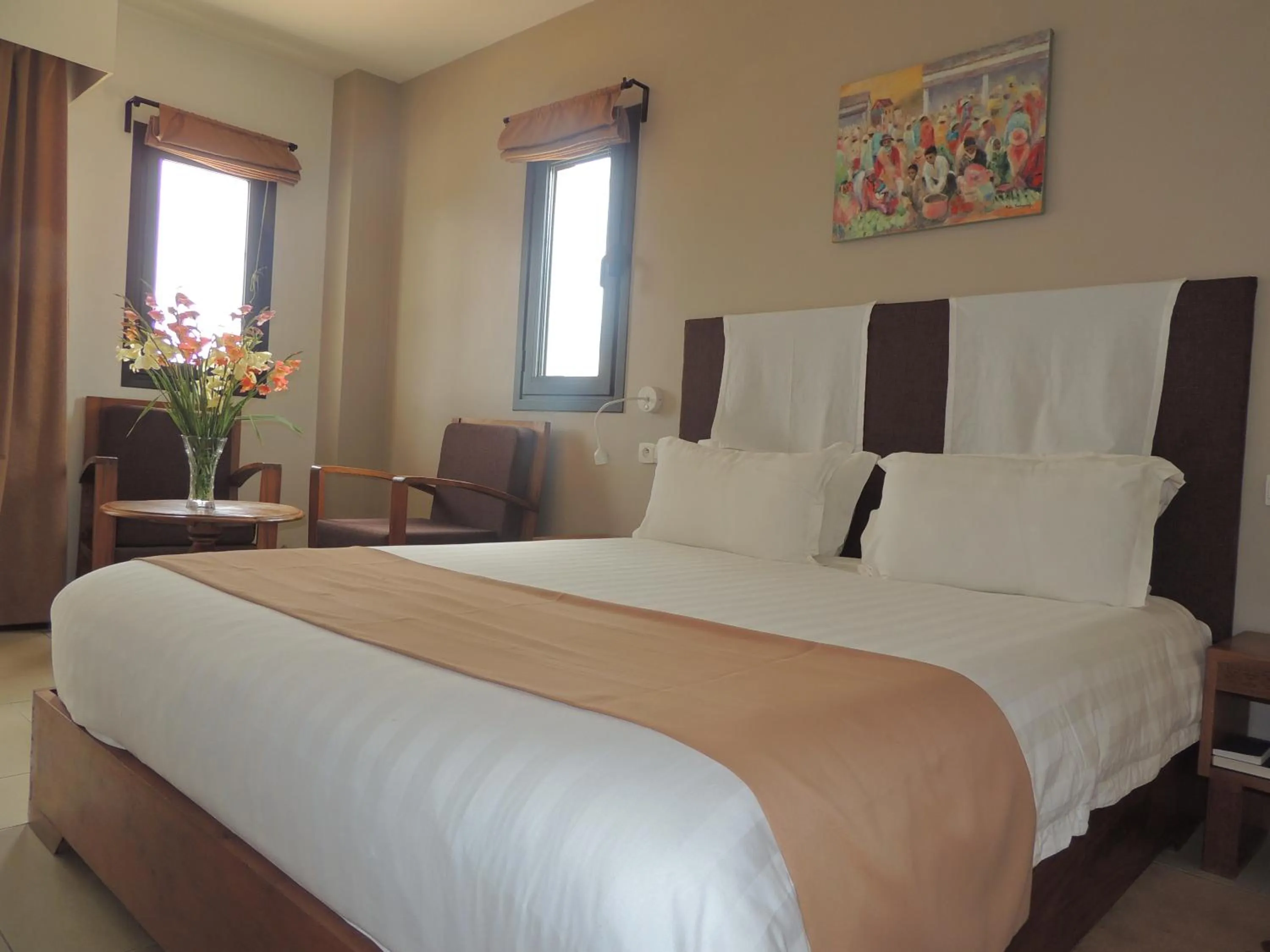 Bed in Plumeria Hotel