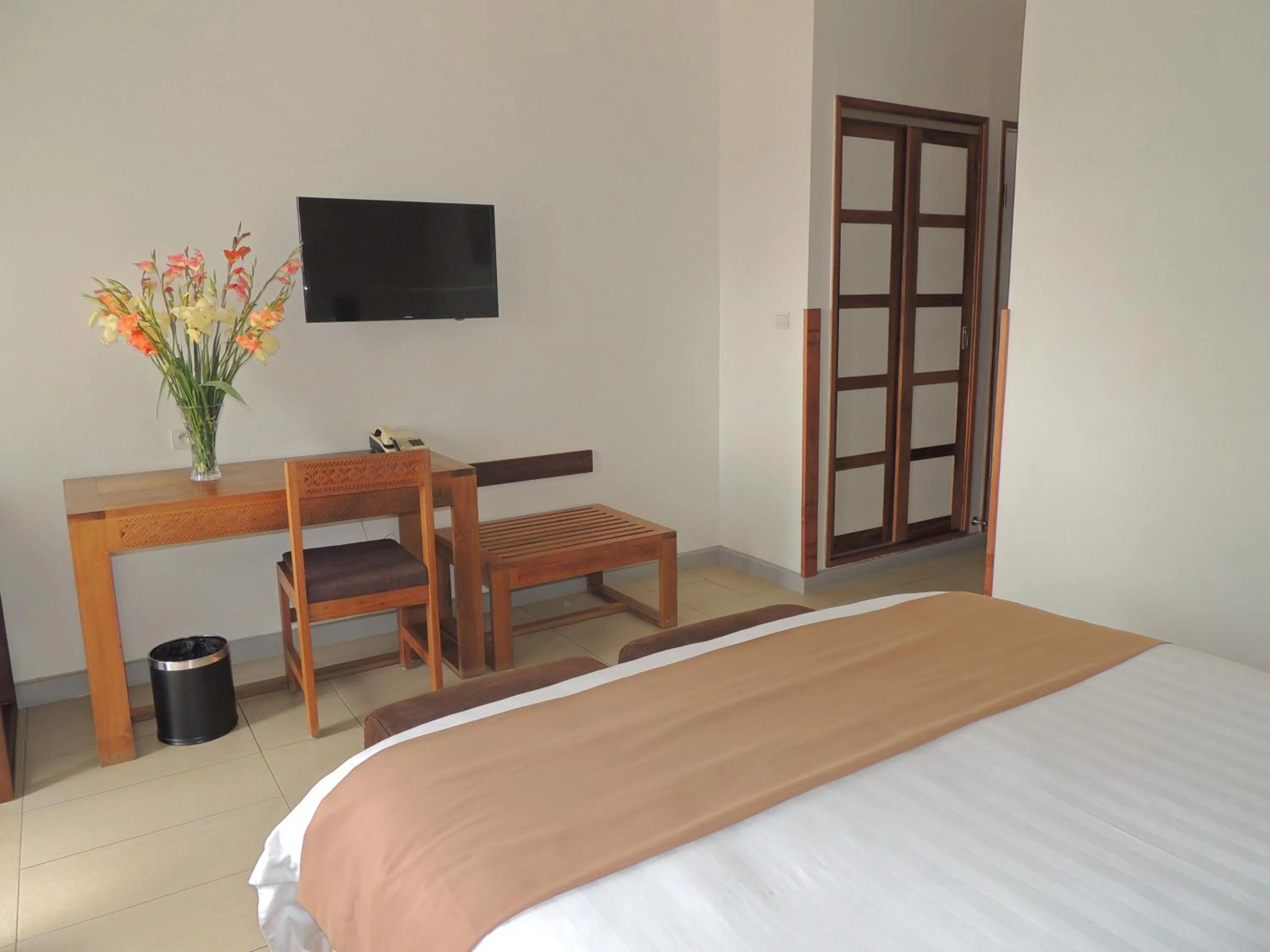 Bed in Plumeria Hotel