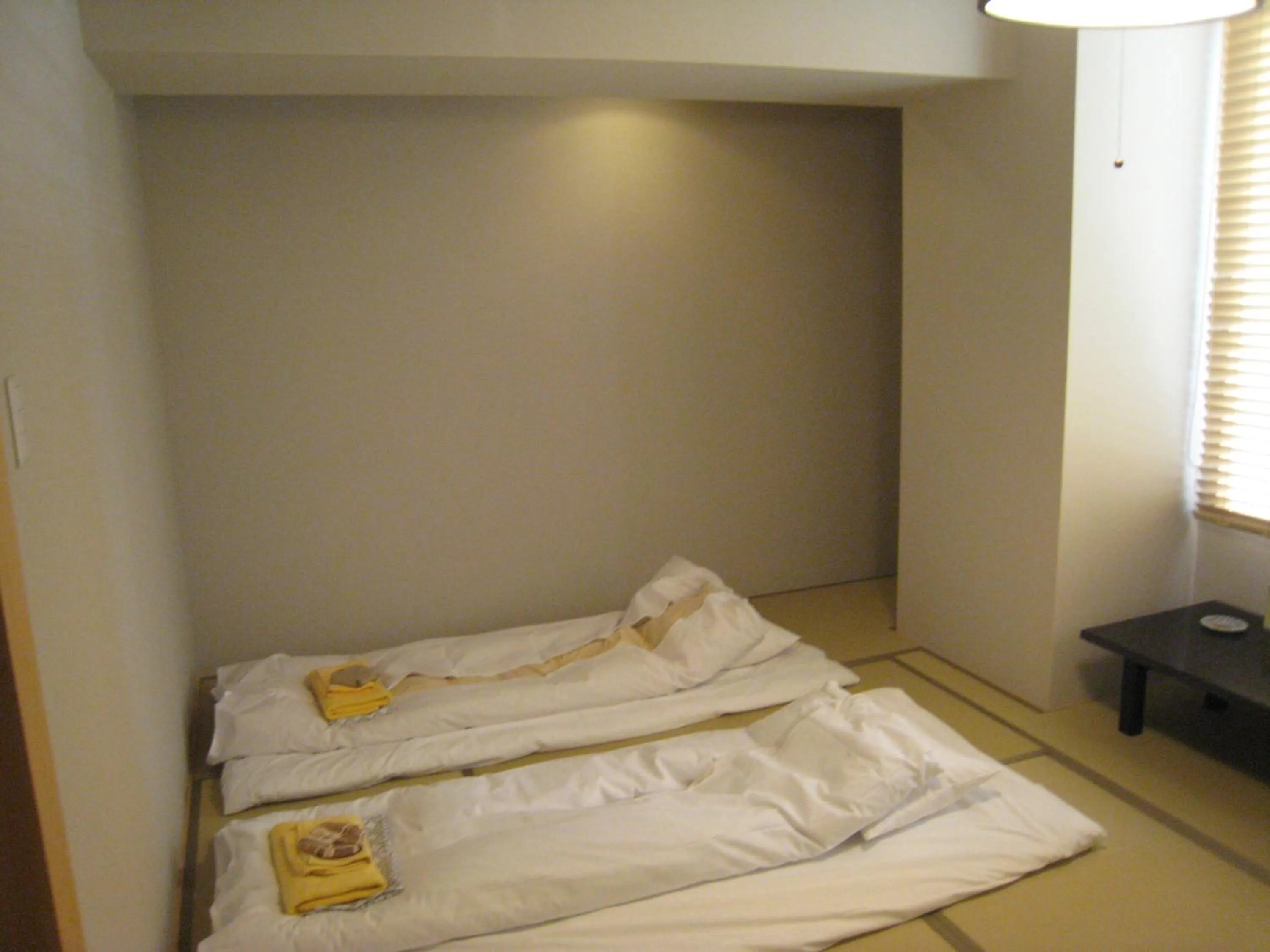 Bed in Kumagaya Royal Hotel Suzuki