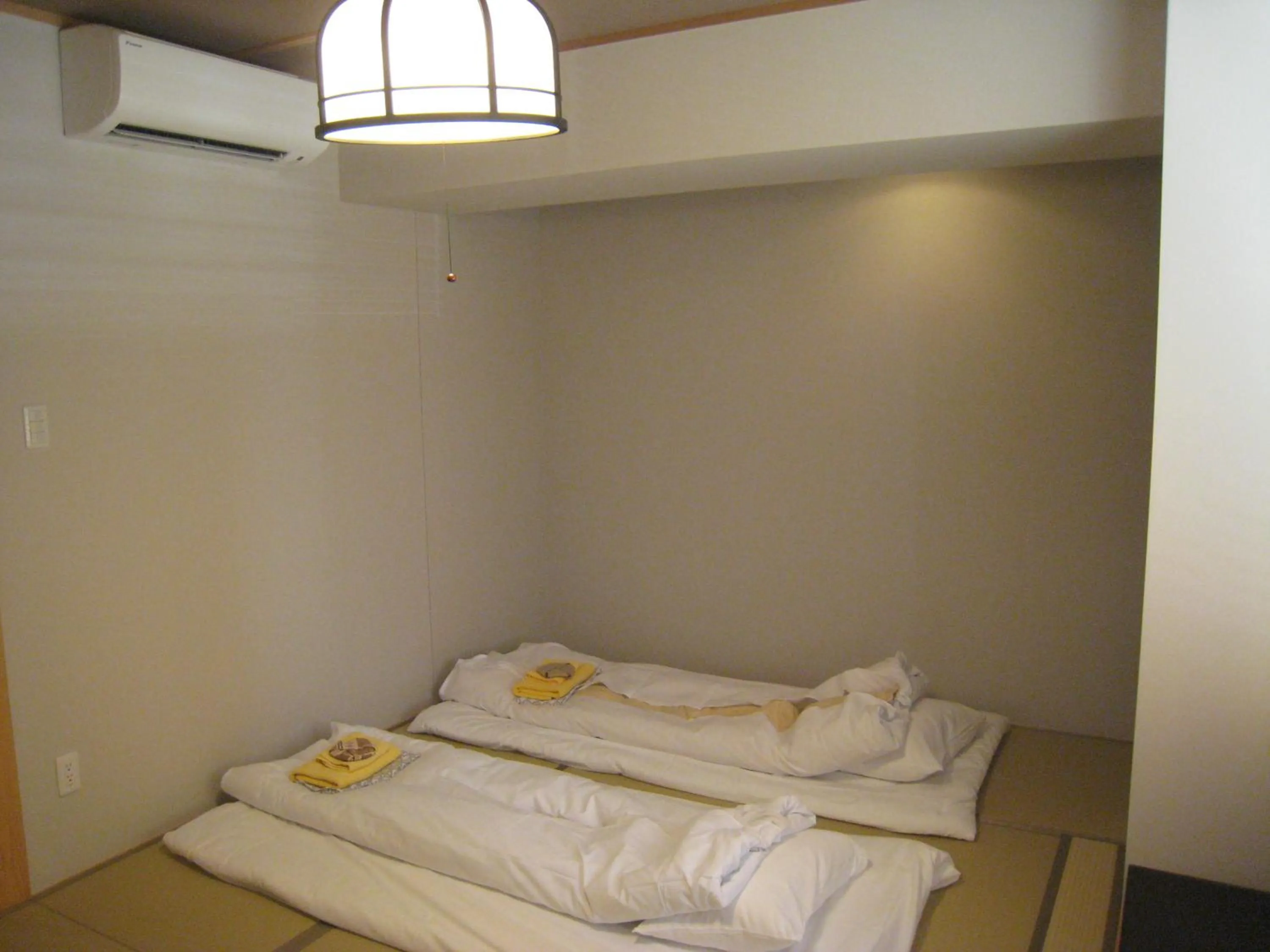 Bed in Kumagaya Royal Hotel Suzuki