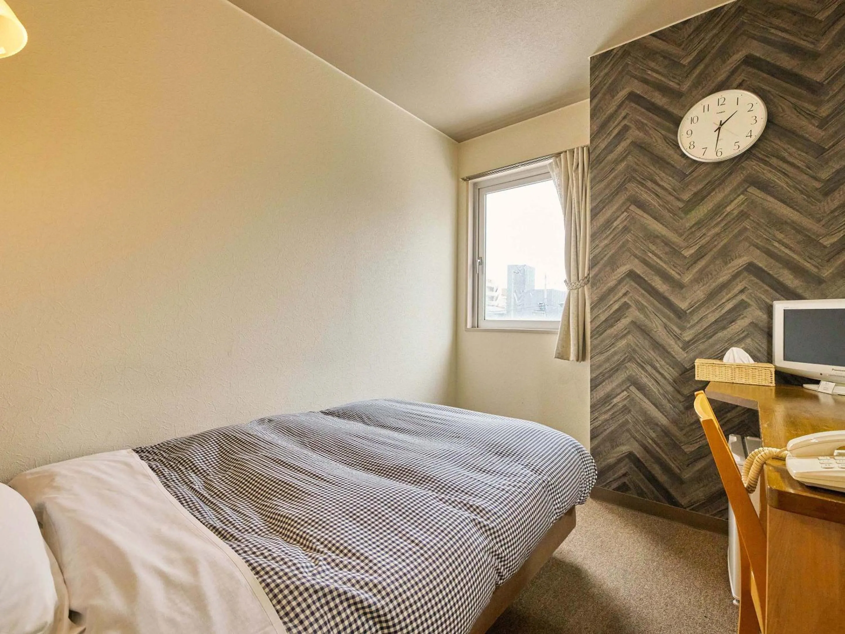 Bed in Kumagaya Royal Hotel Suzuki