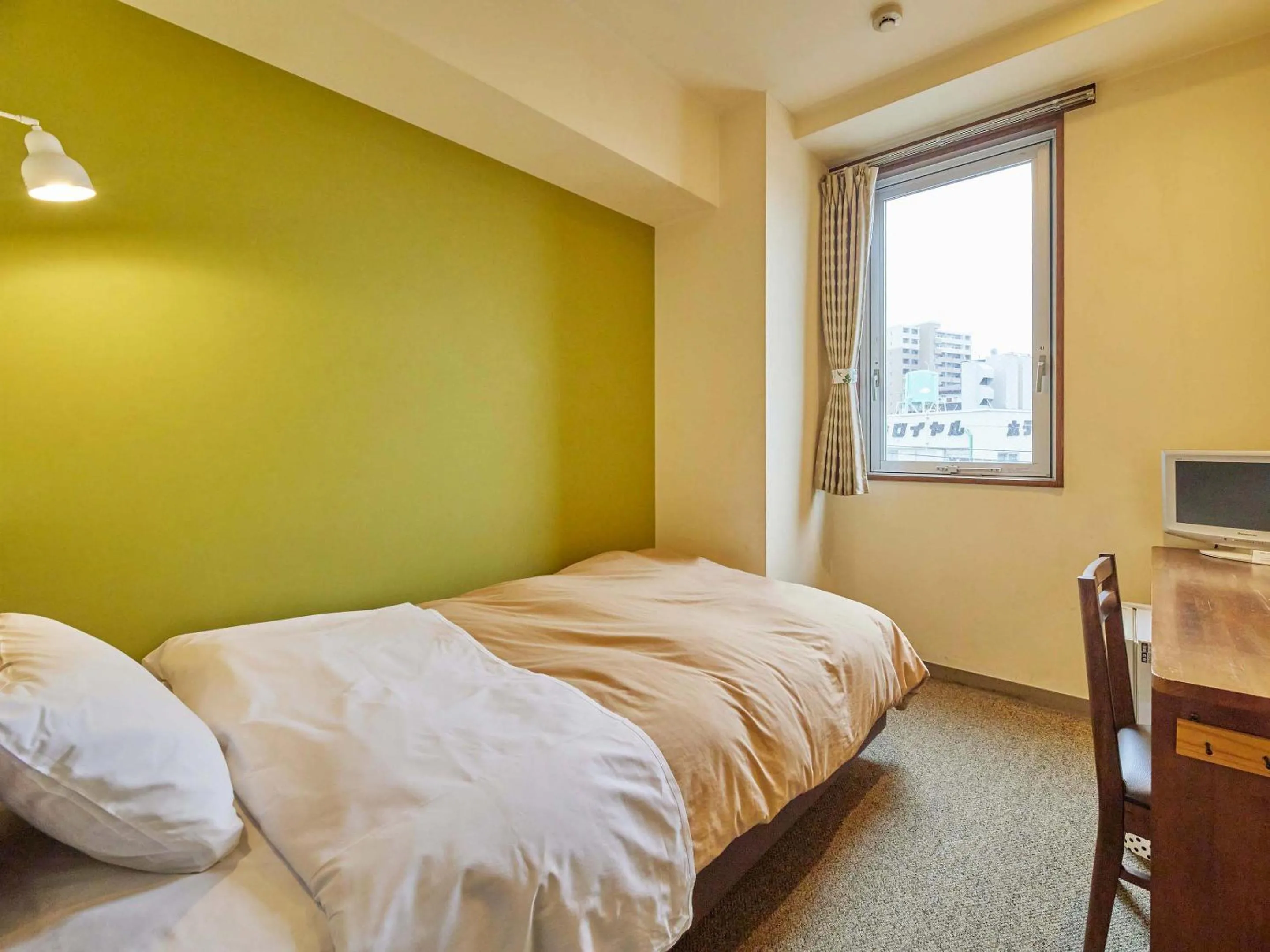 Bed in Kumagaya Royal Hotel Suzuki