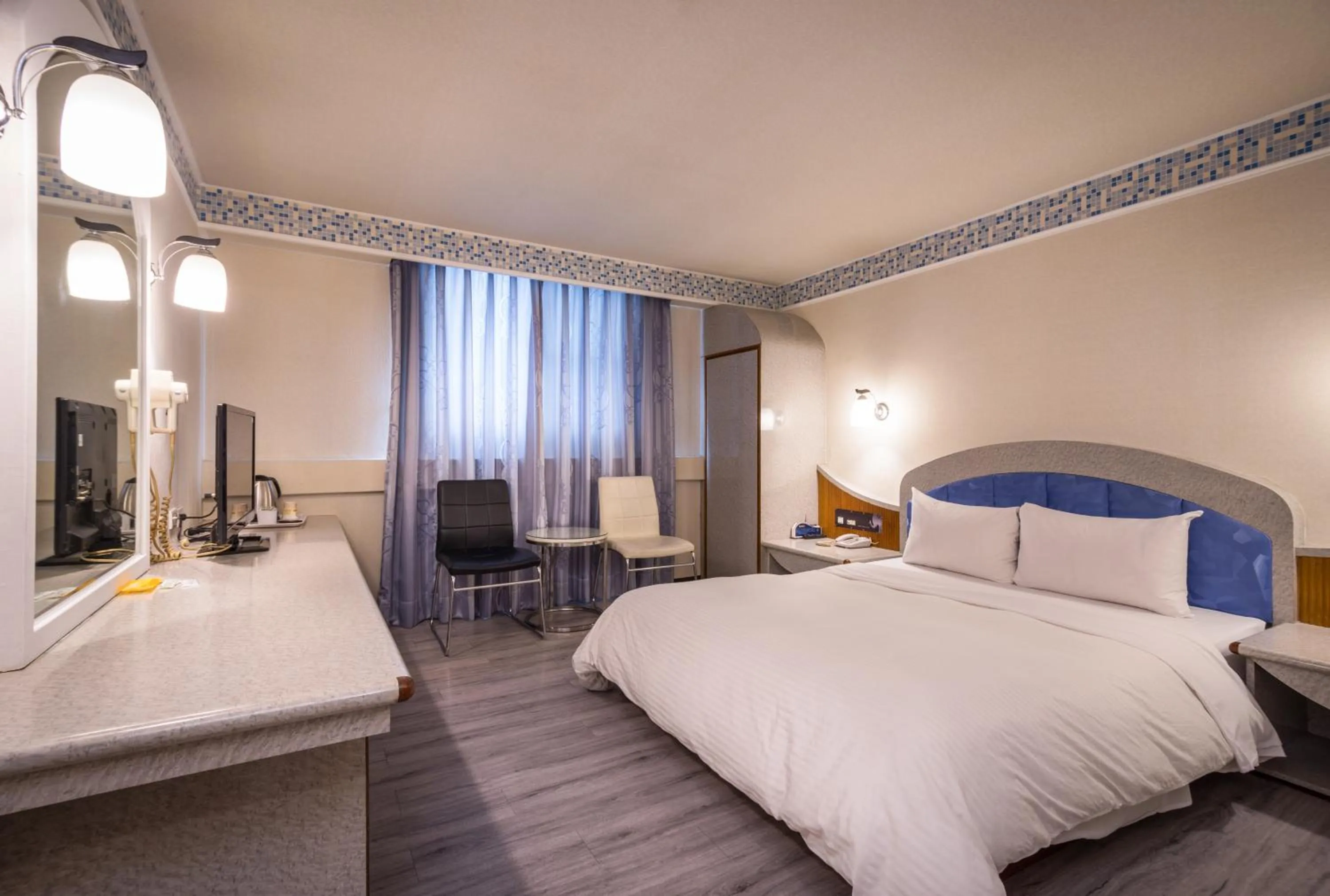 Bed in Golden Phoenix Hotel