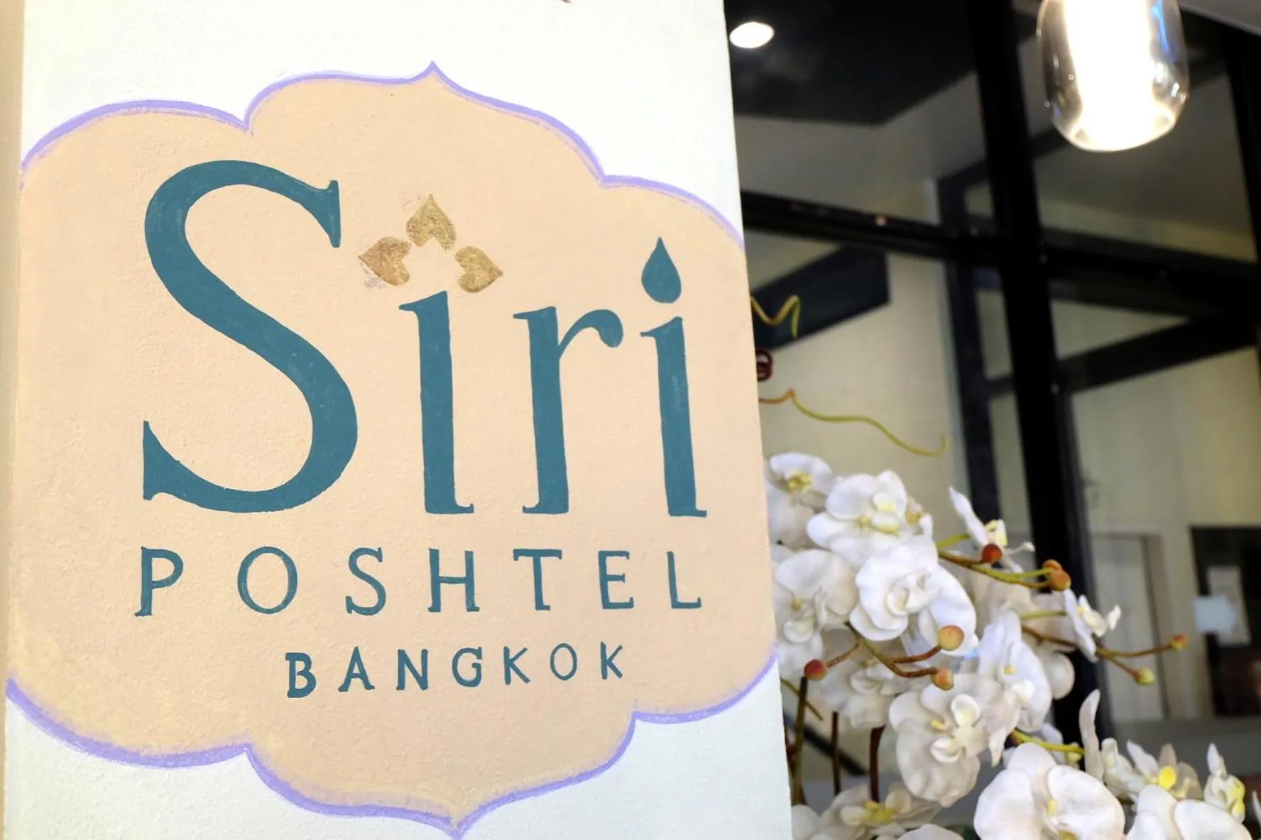 Property logo or sign in Siri Poshtel Bangkok