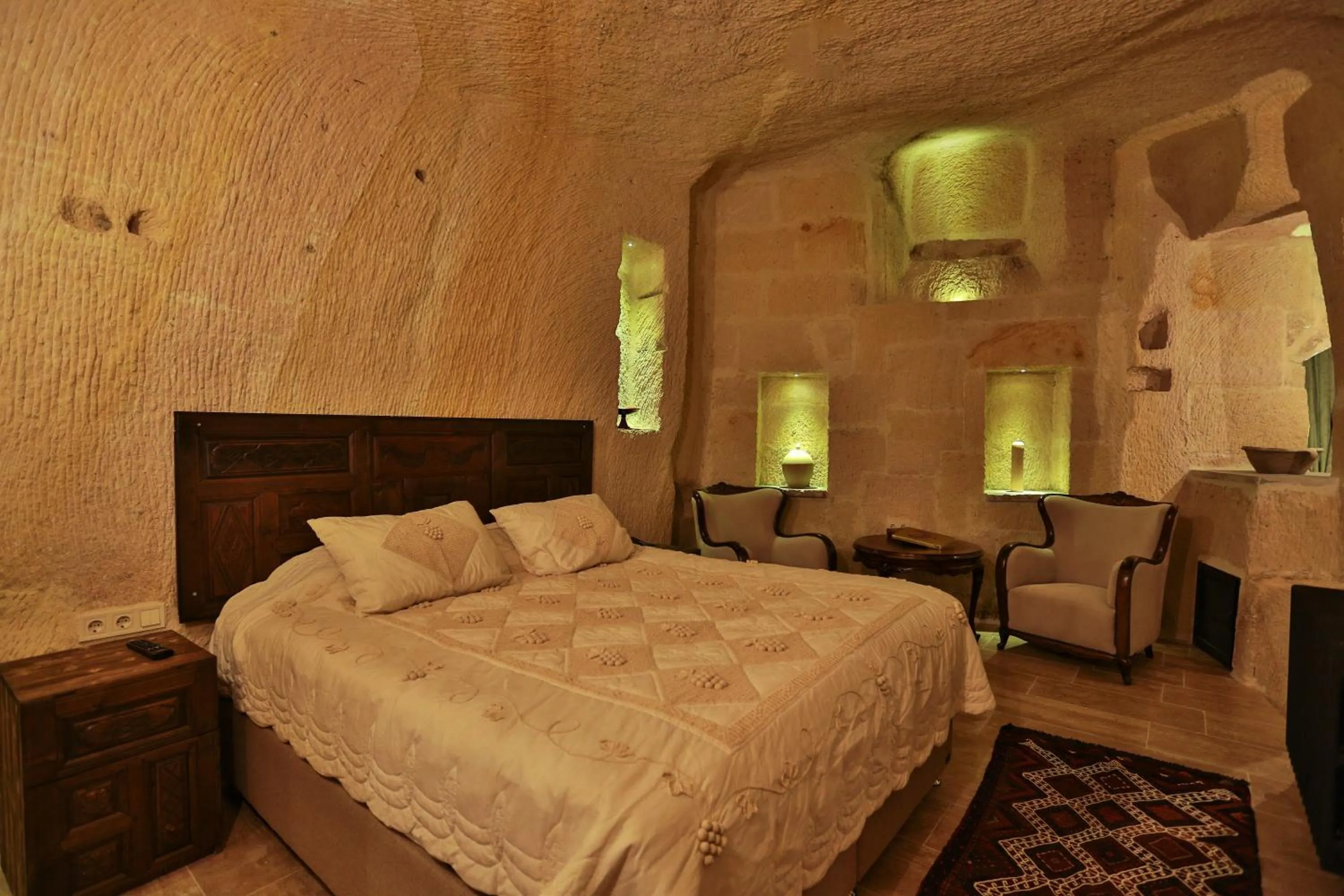 Bed in Acropolis Cave Suite