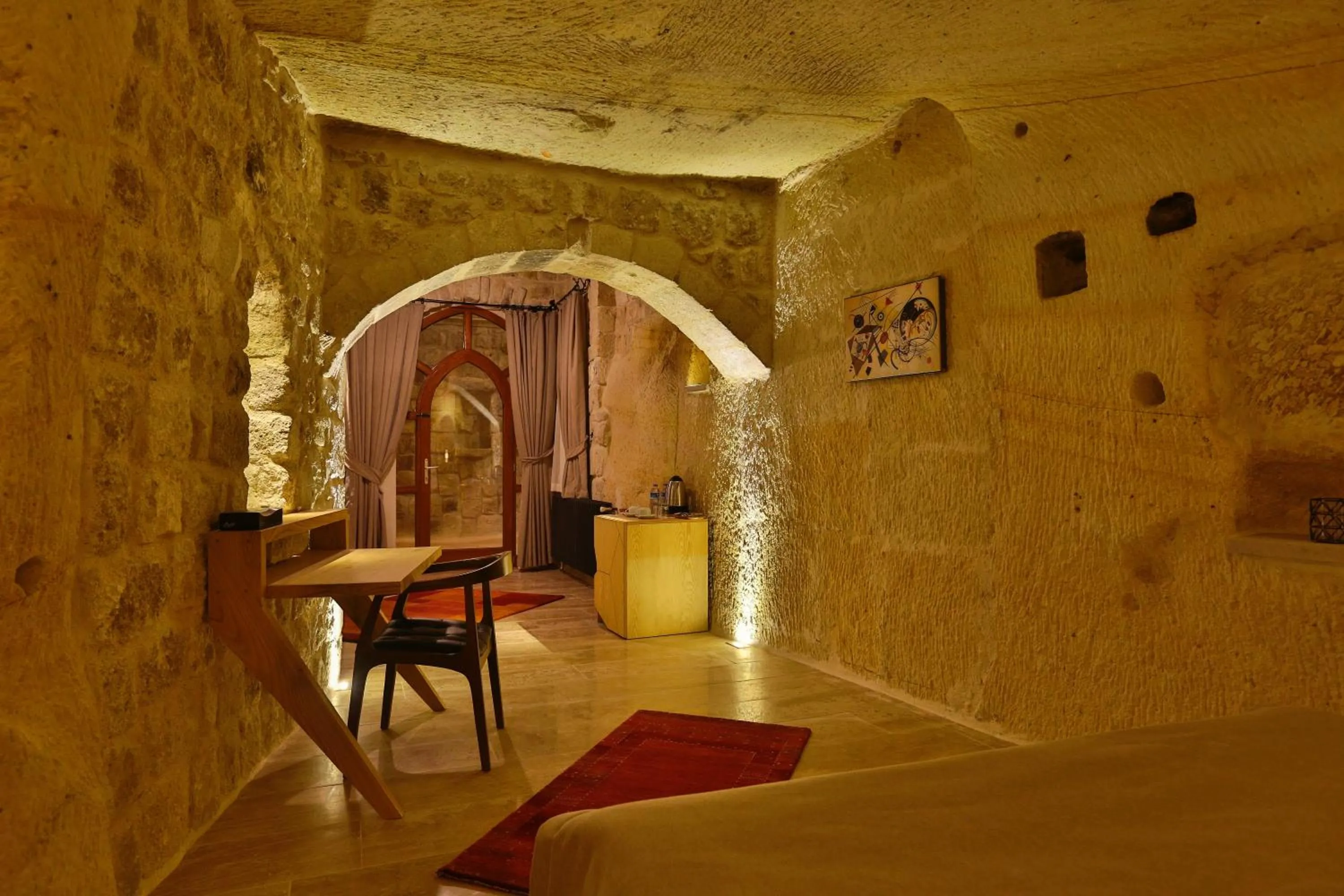 Bed in Acropolis Cave Suite