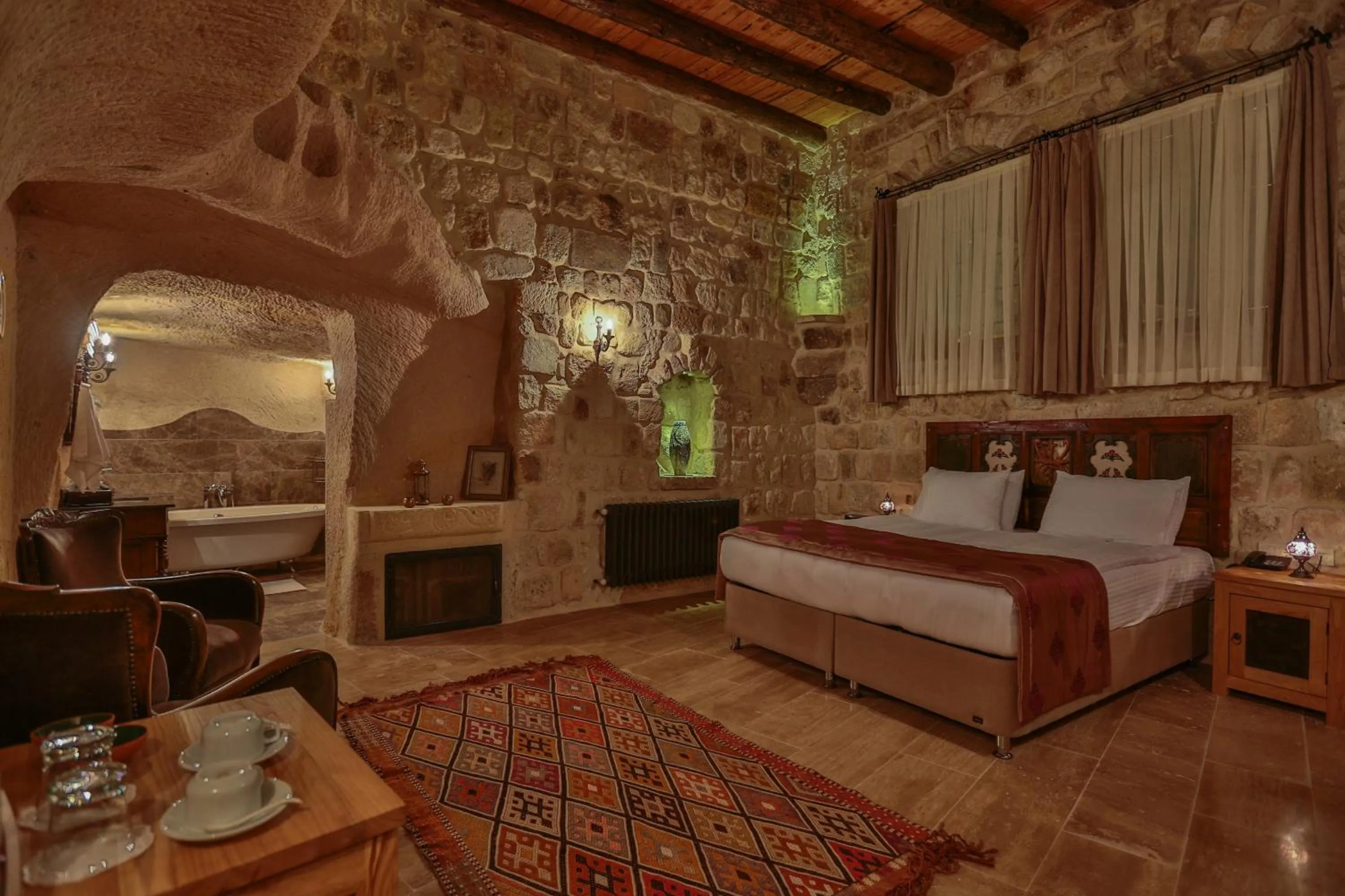 Bed in Acropolis Cave Suite