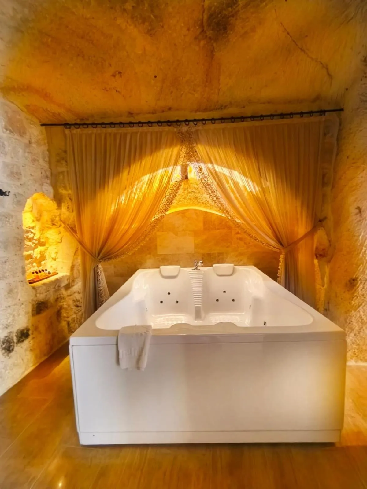 Hot Tub, Bed in Acropolis Cave Suite