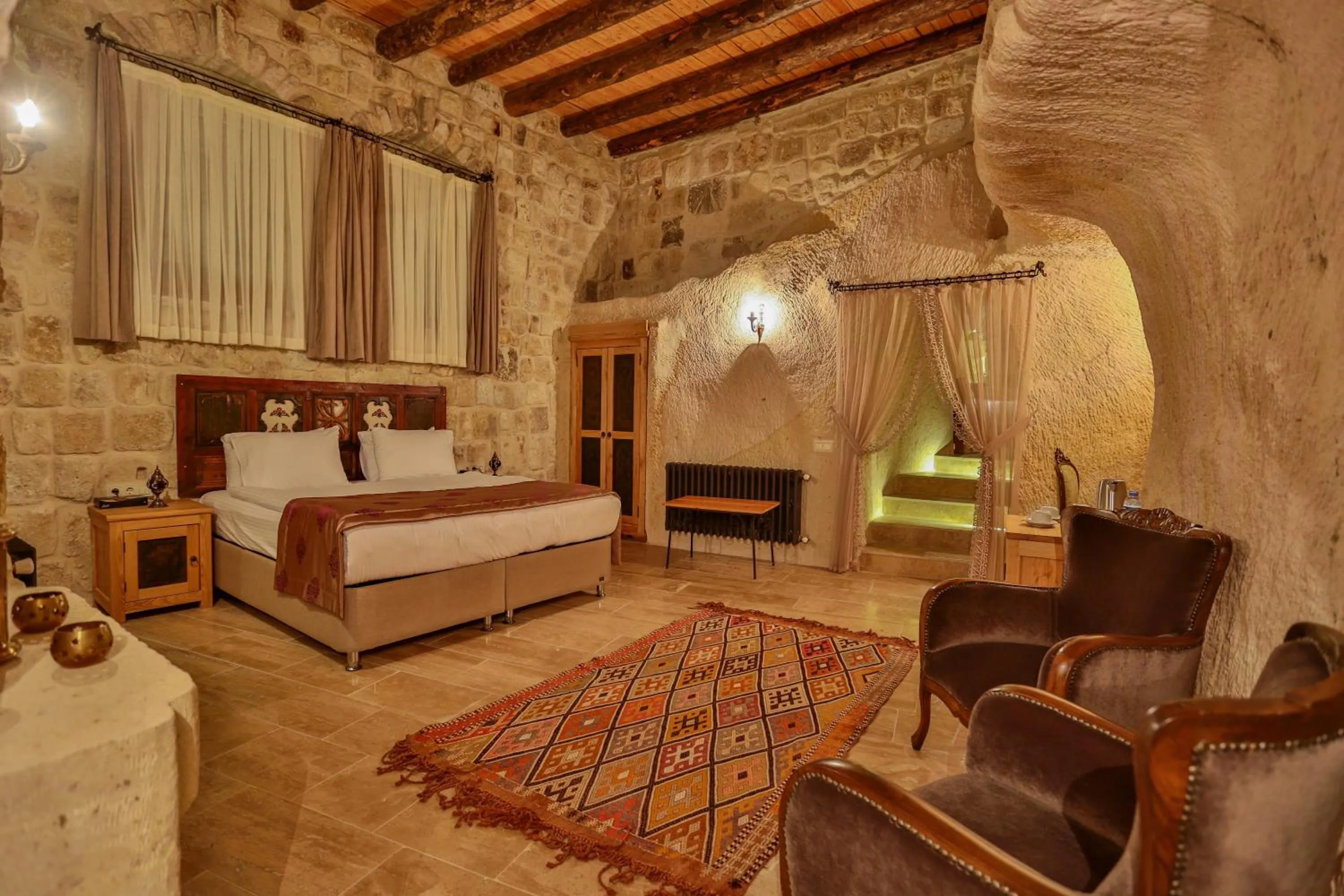Photo of the whole room, Bed in Acropolis Cave Suite