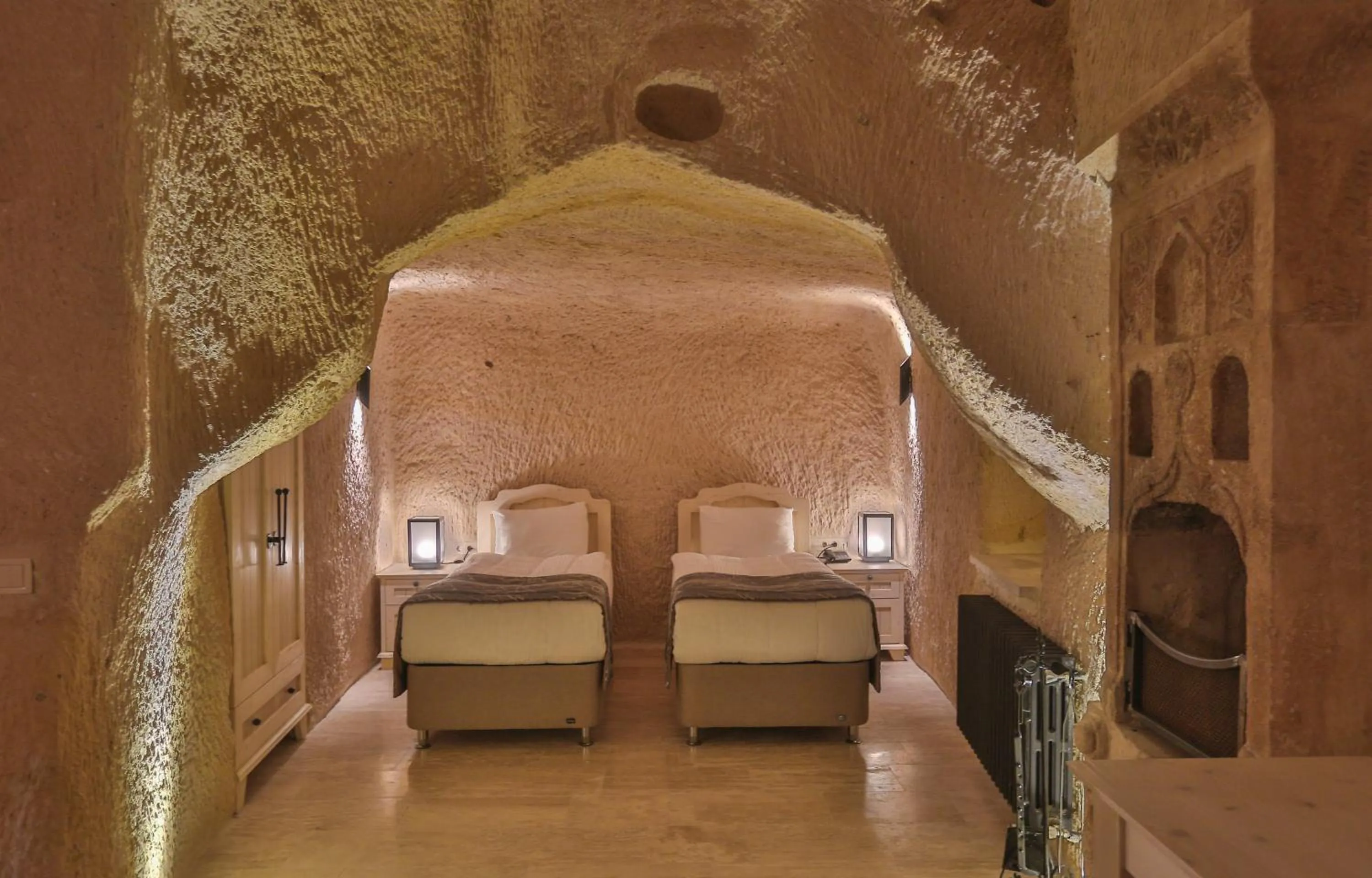 Bed in Acropolis Cave Suite