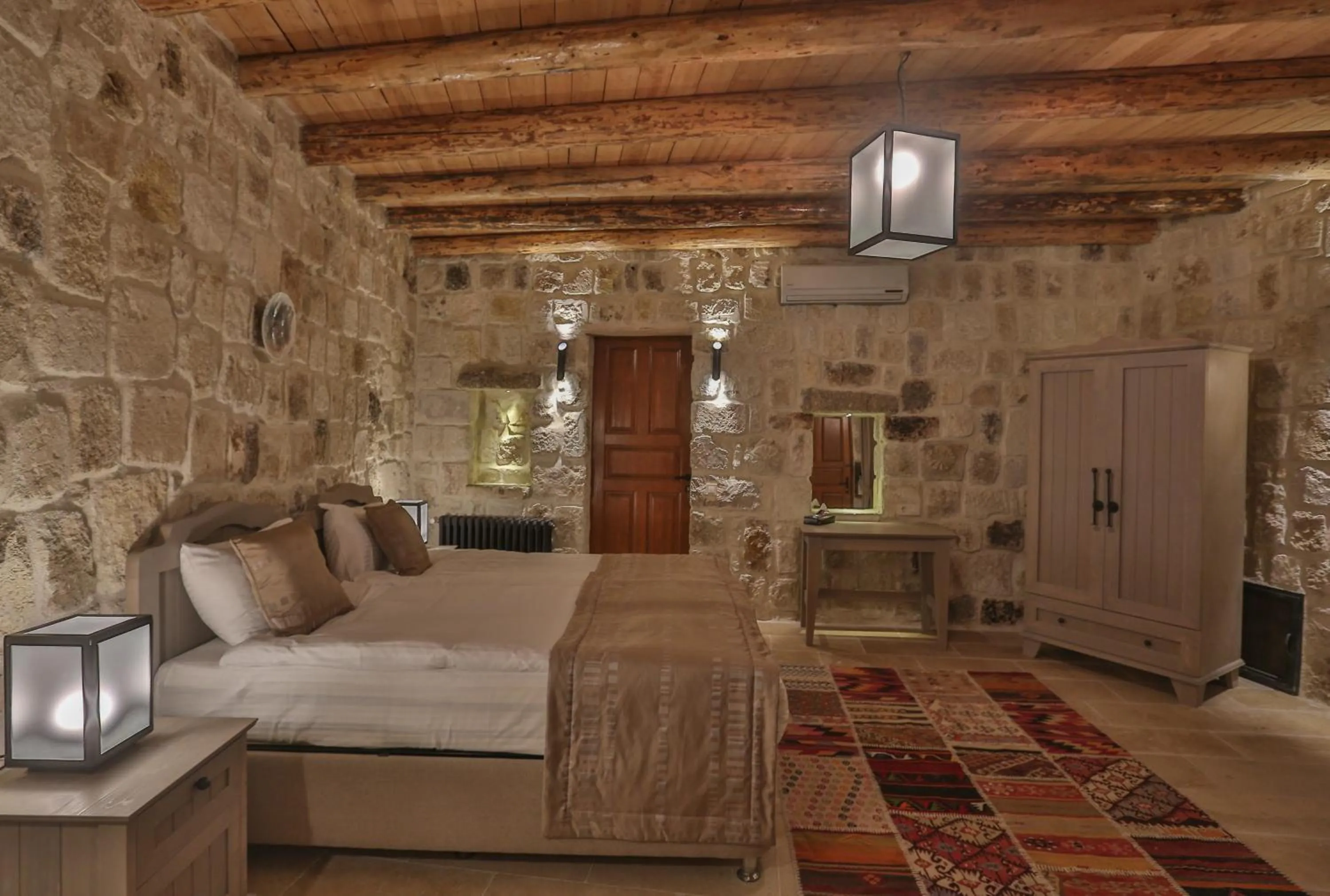 Bed in Acropolis Cave Suite