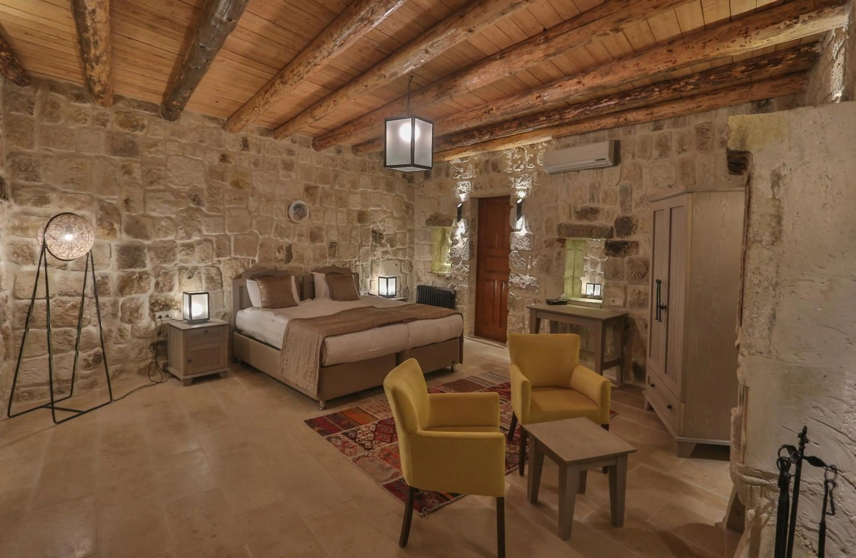 Bed in Acropolis Cave Suite