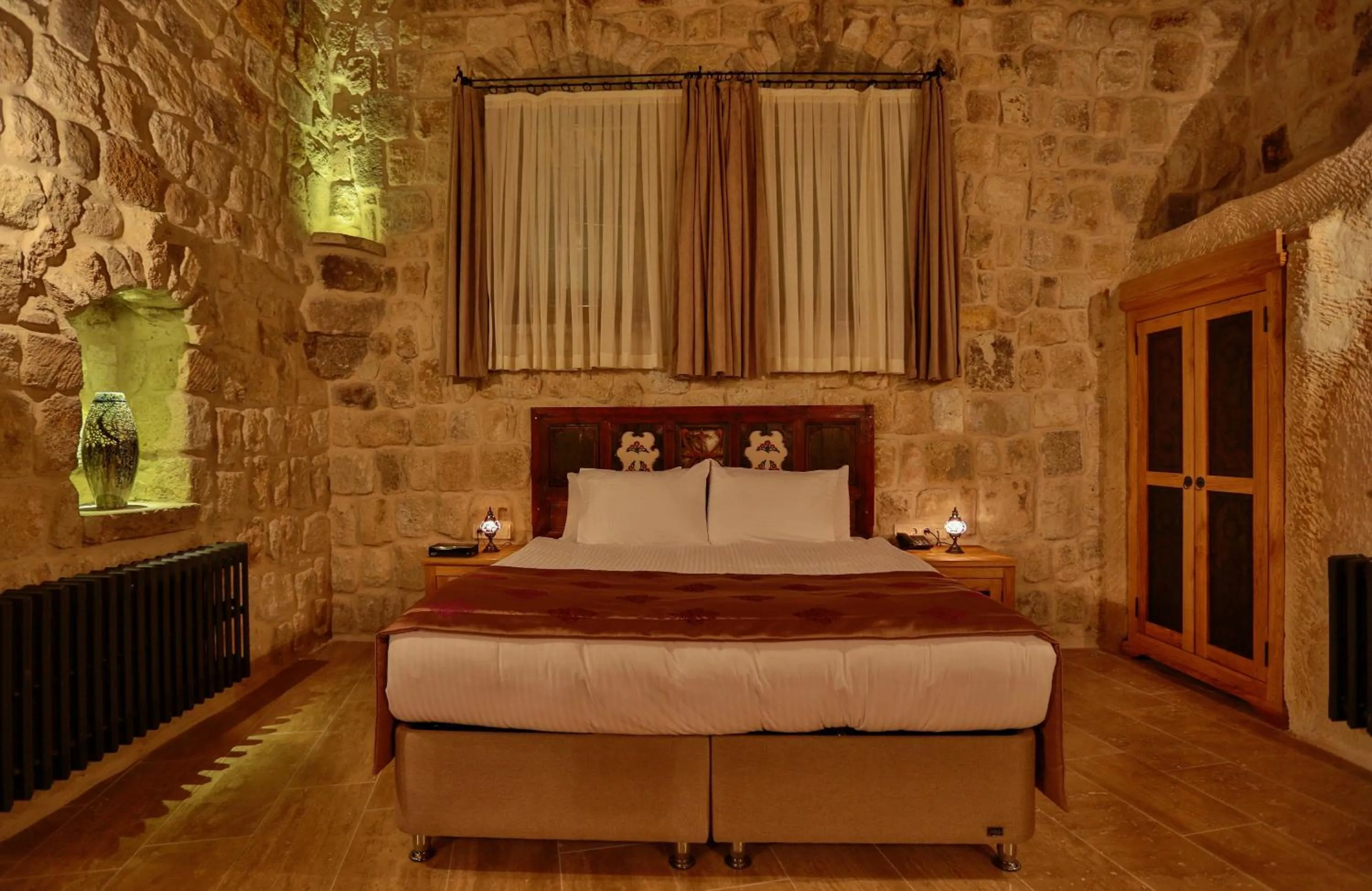 Bed in Acropolis Cave Suite