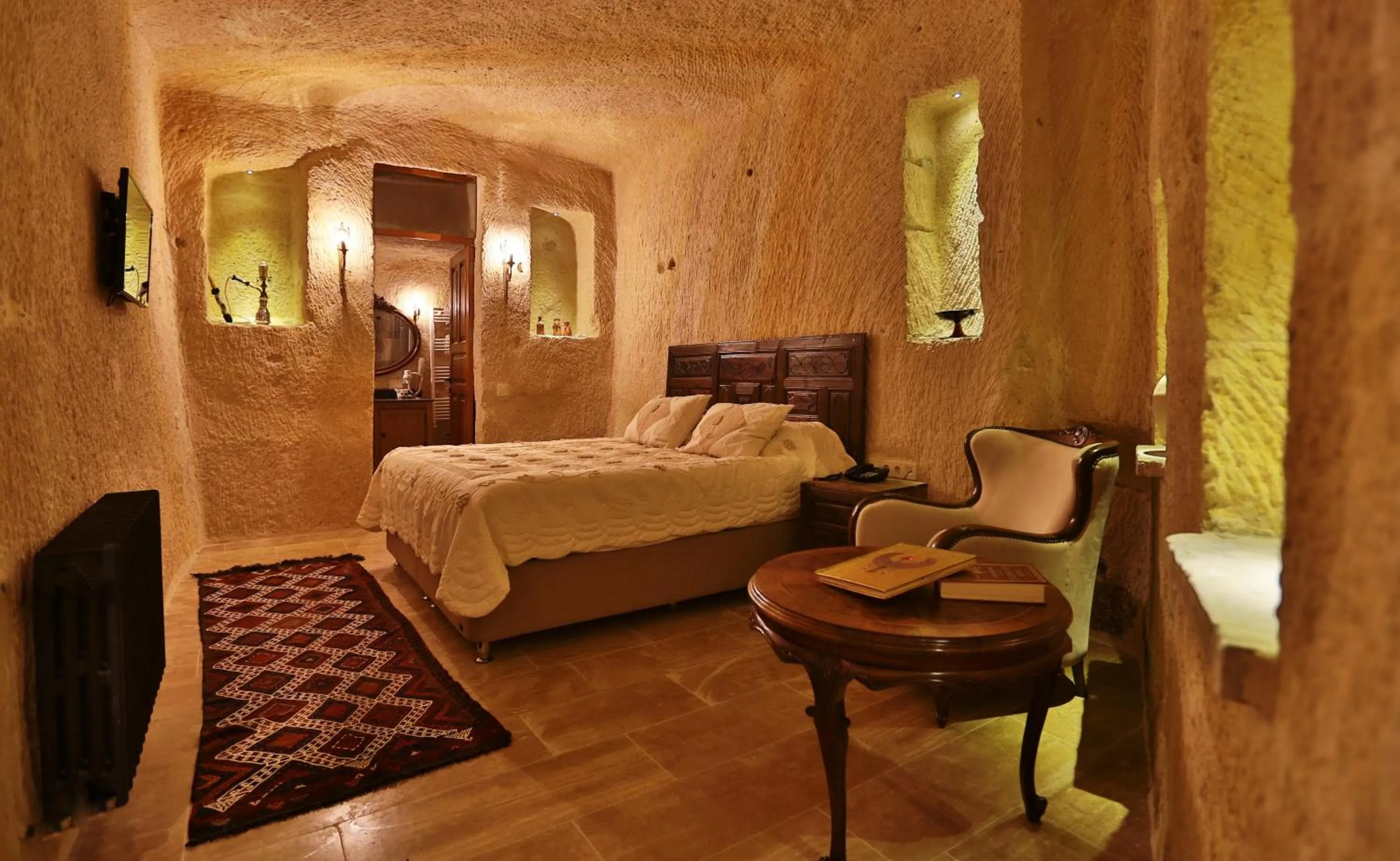 Bed in Acropolis Cave Suite