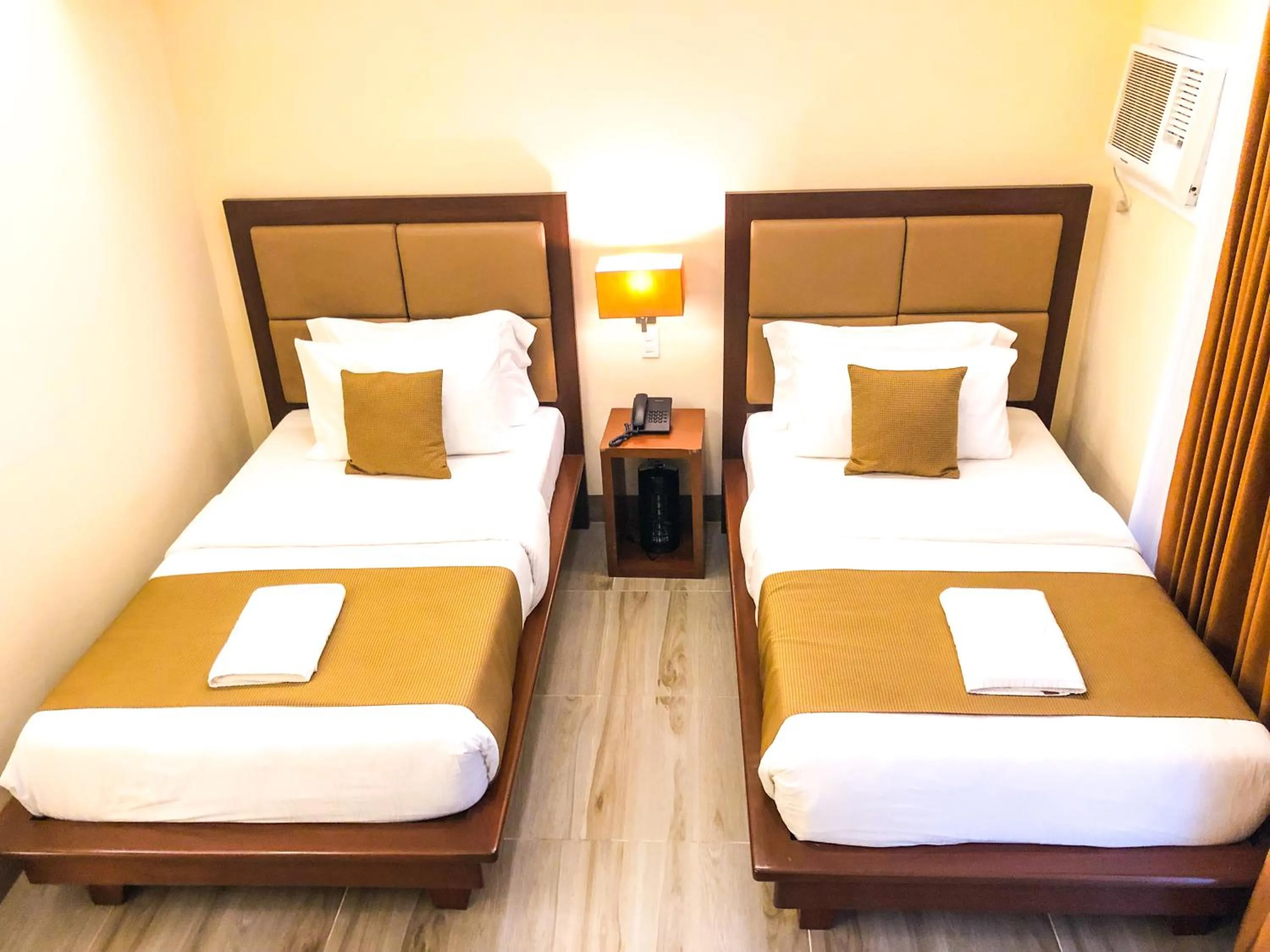 Photo of the whole room, Bed in The Piccolo Hotel of Boracay