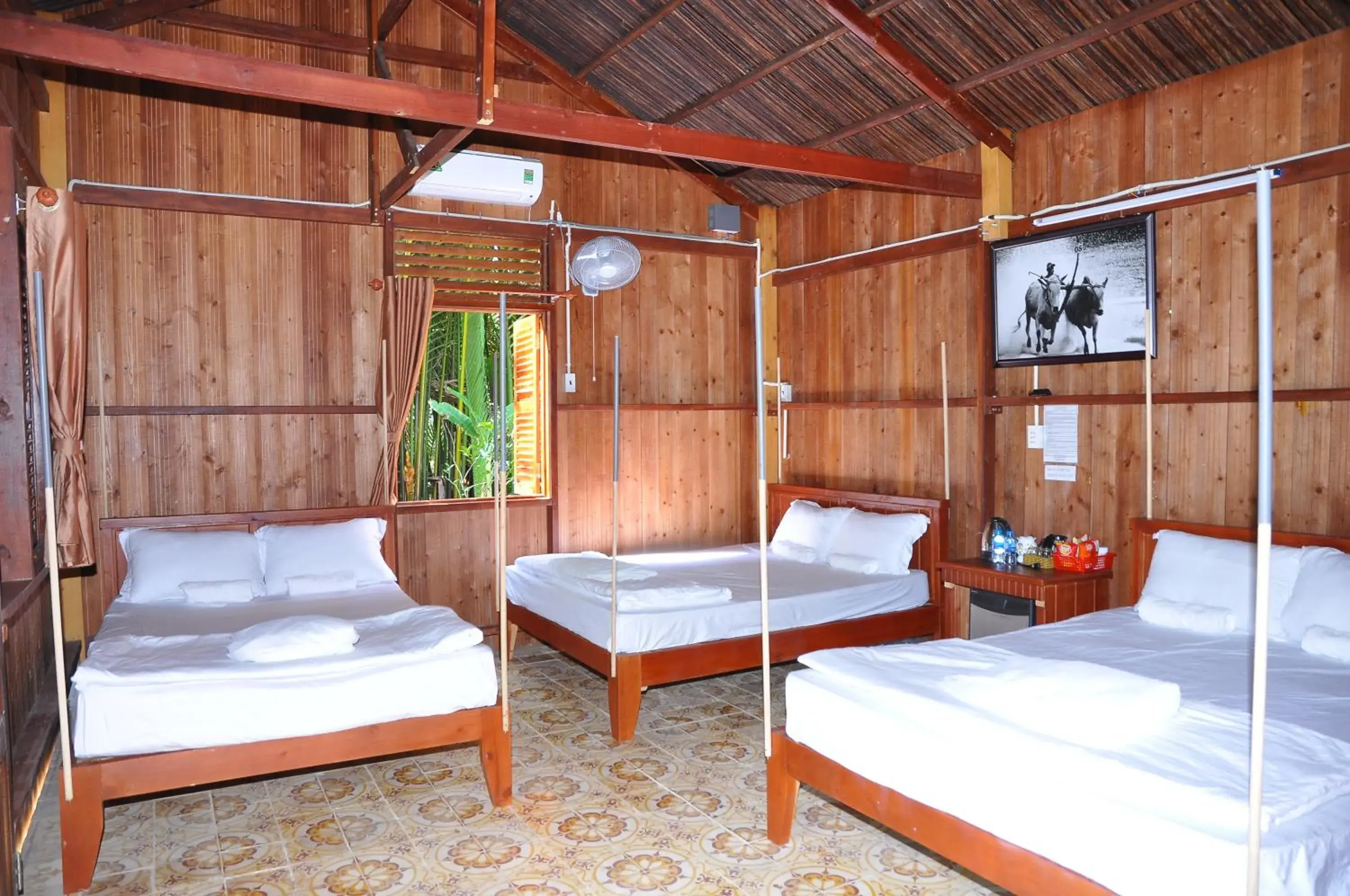 Deluxe Family Room in Ben Tre Farm Stay Deluxe Family Room in Ben Tre Farm Stay