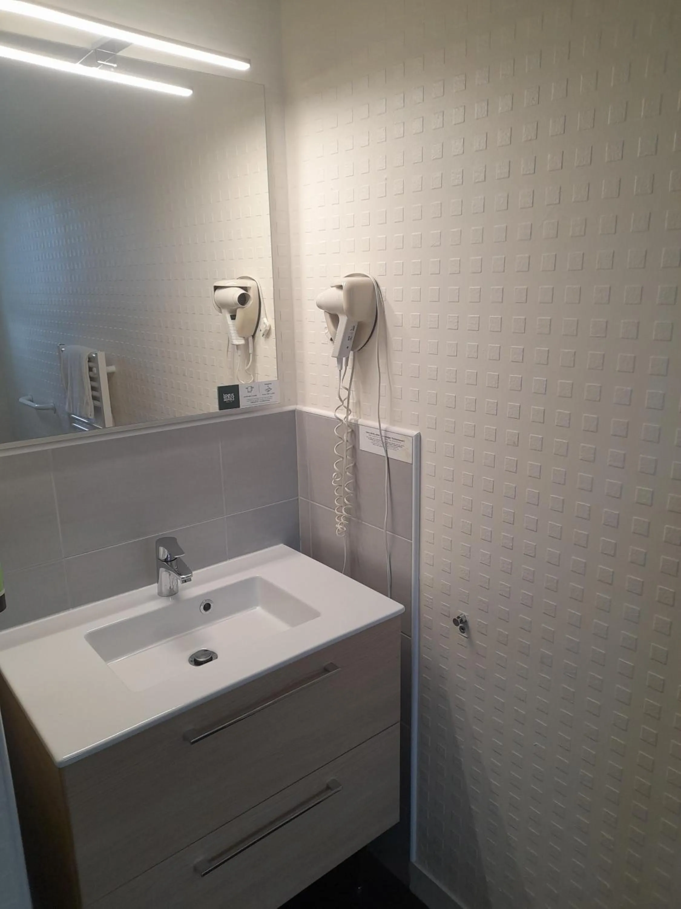 Bathroom in Logis Hôtel Lodge La Valette