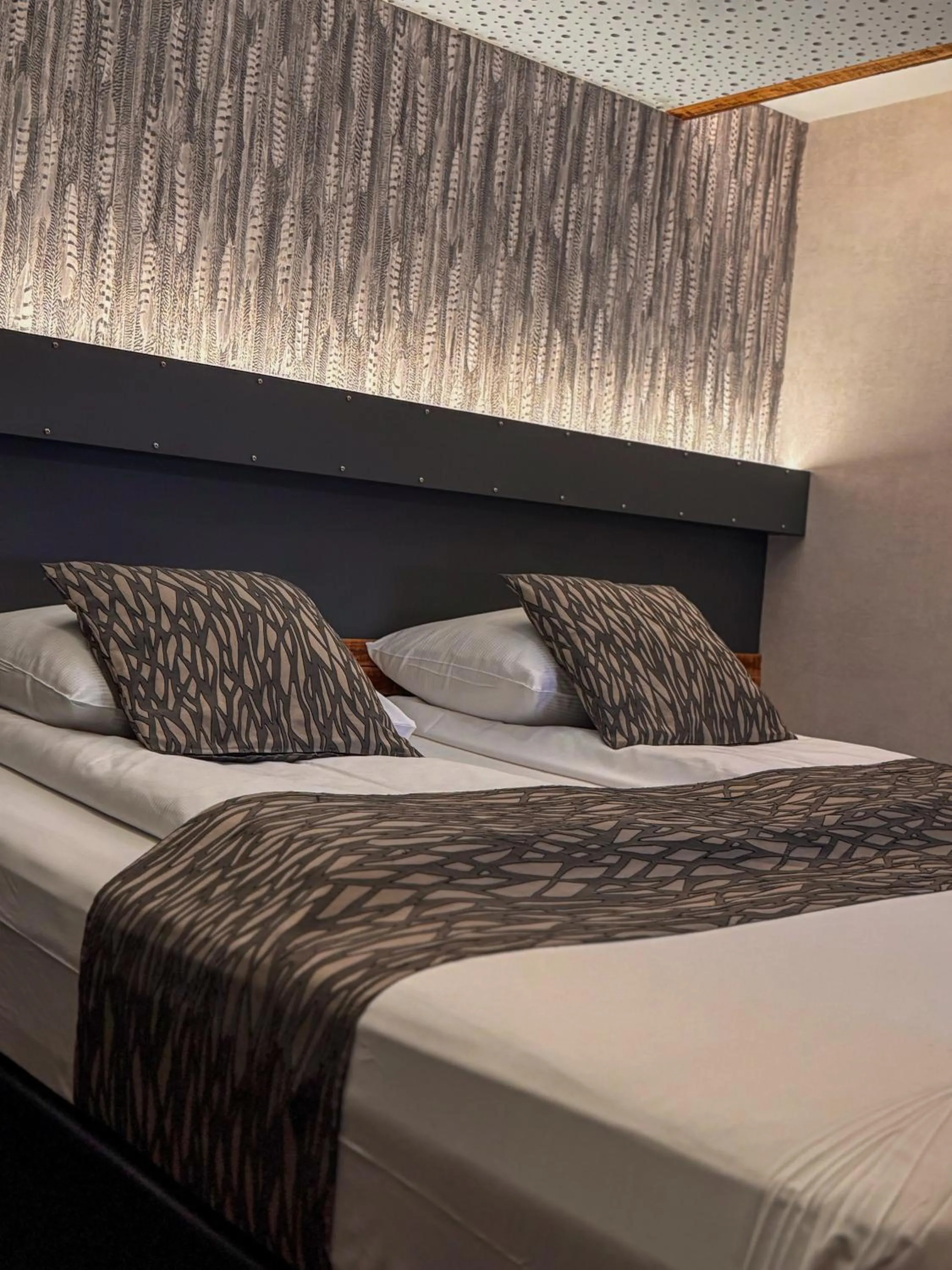 Bed in RAVeL Hotel Cyrano