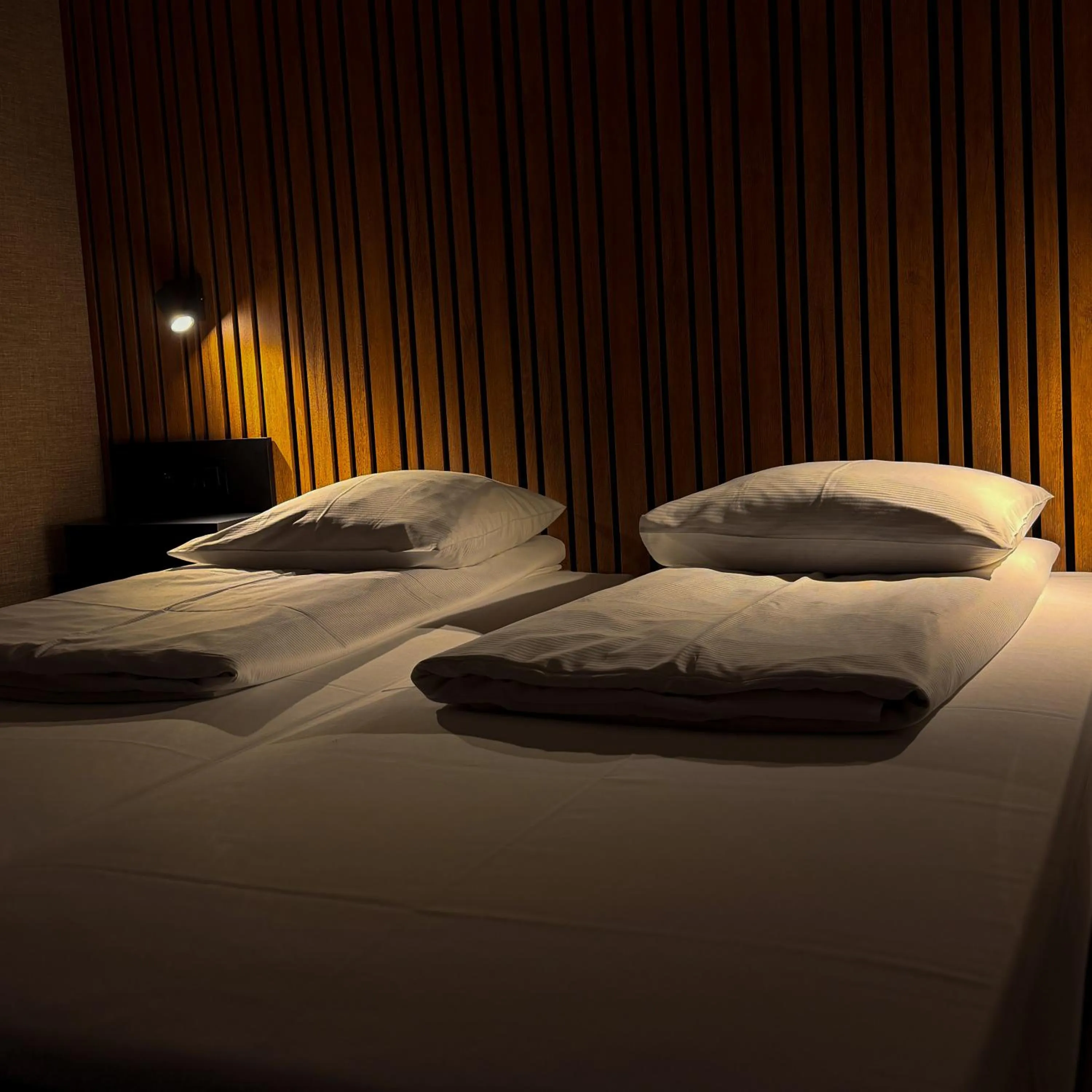 Bed in RAVeL Hotel Cyrano