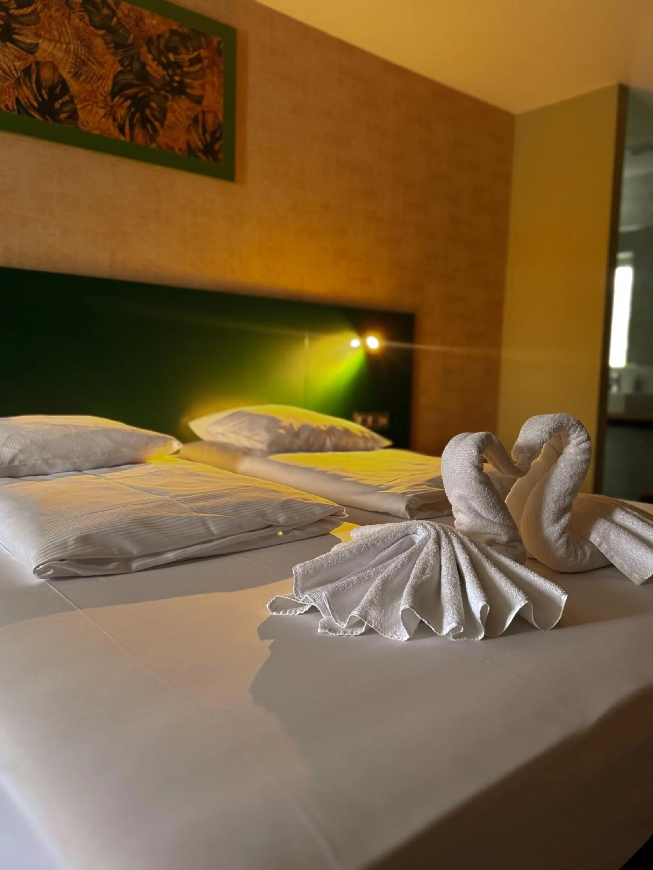 Bed in RAVeL Hotel Cyrano