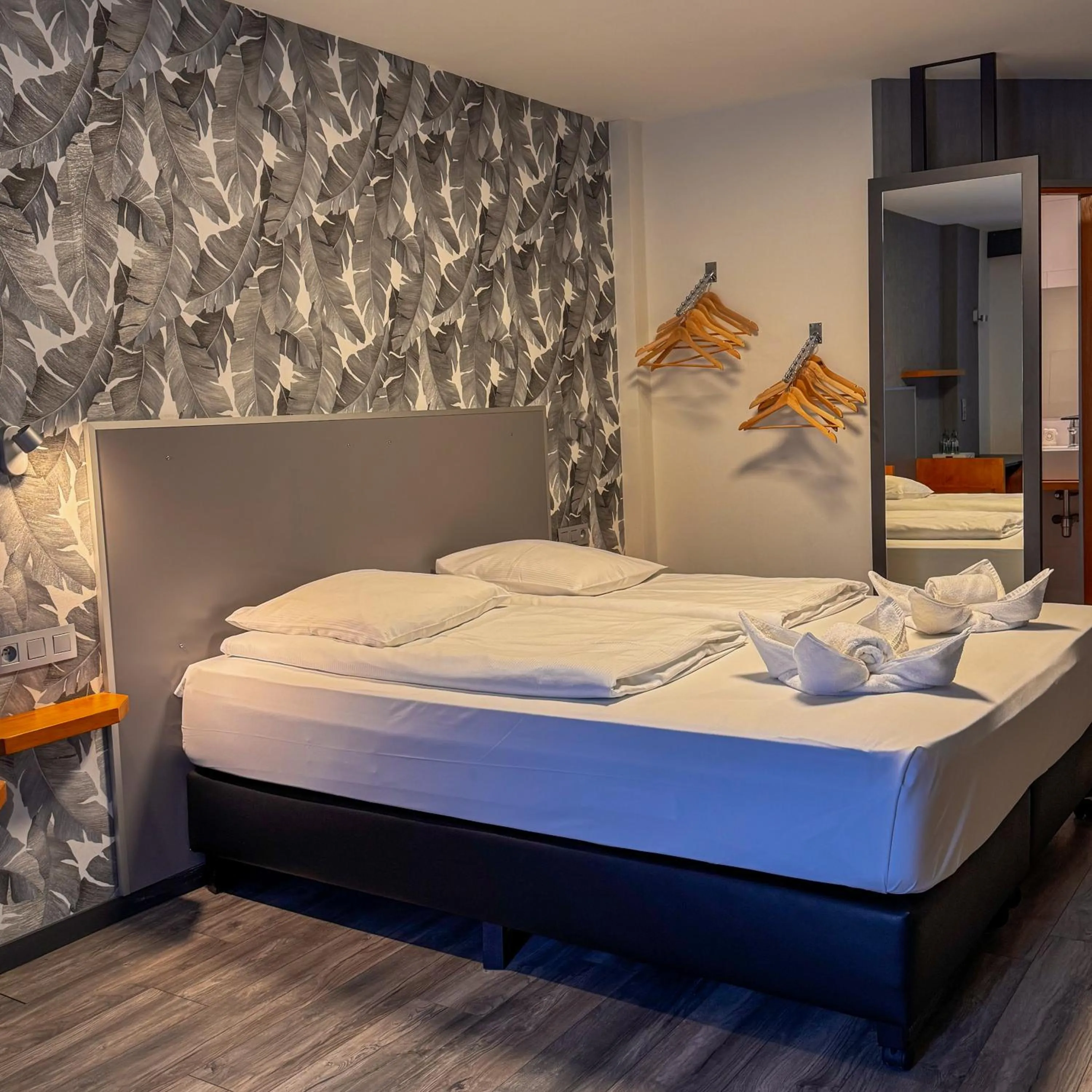 Bed in RAVeL Hotel Cyrano