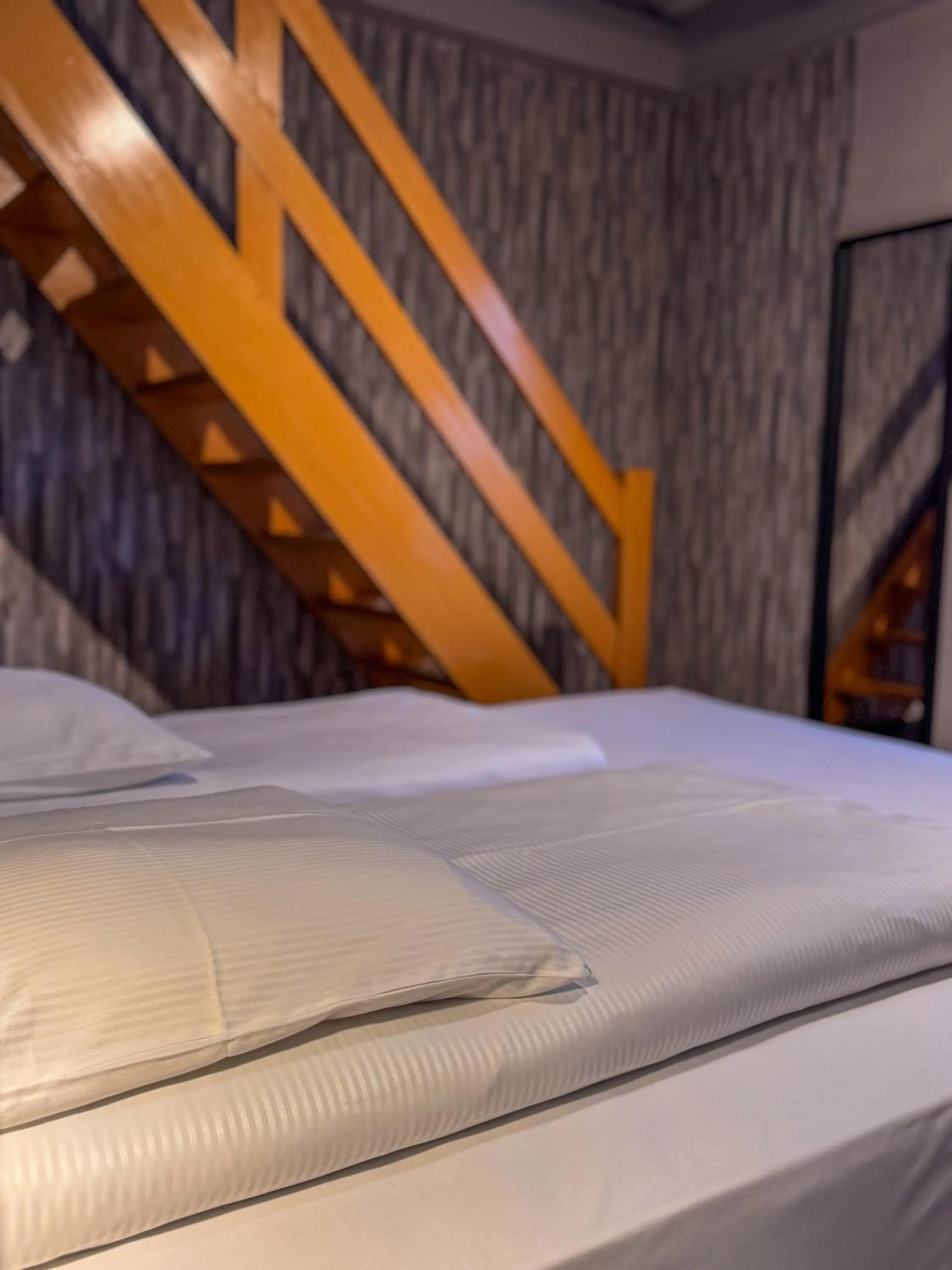 Bed in RAVeL Hotel Cyrano