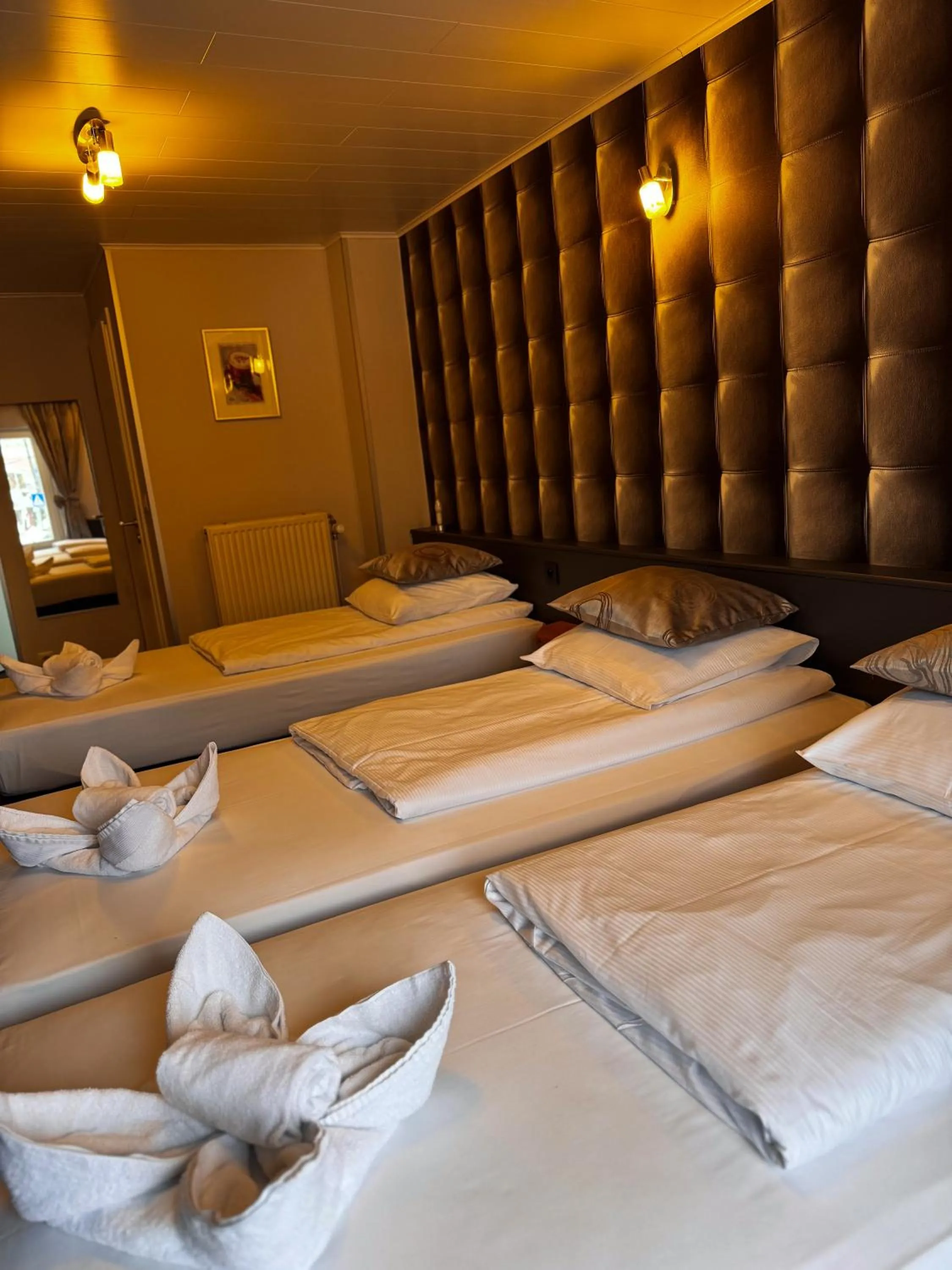 Bed in RAVeL Hotel Cyrano