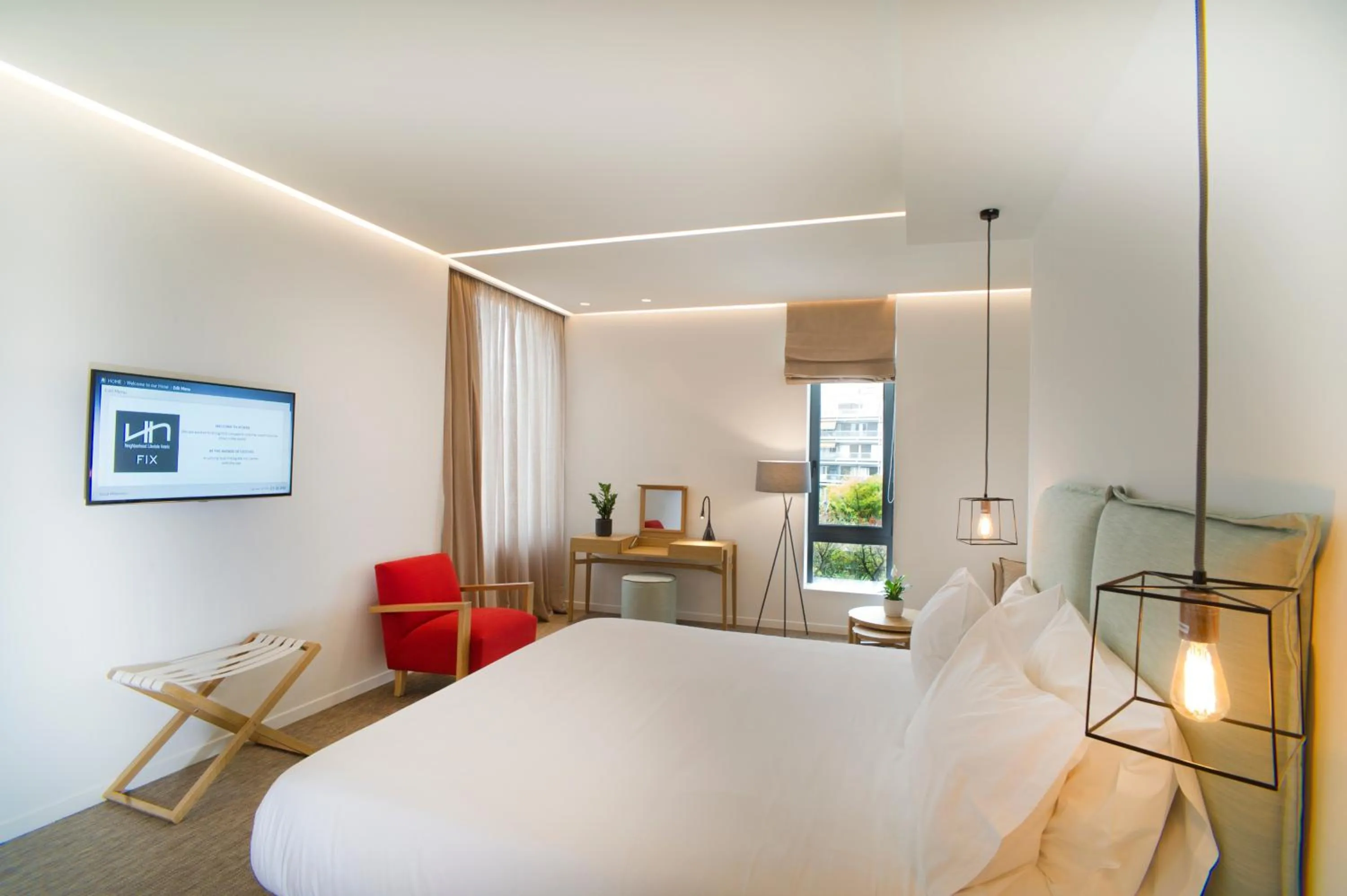 Seating area, Bed in NLH FIX | Neighborhood Lifestyle Hotels