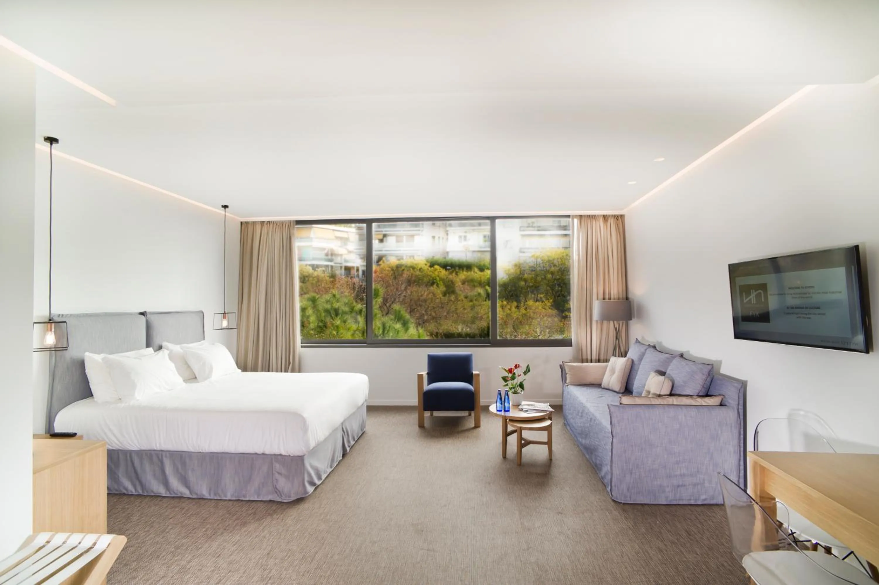 TV and multimedia, Bed in NLH FIX | Neighborhood Lifestyle Hotels