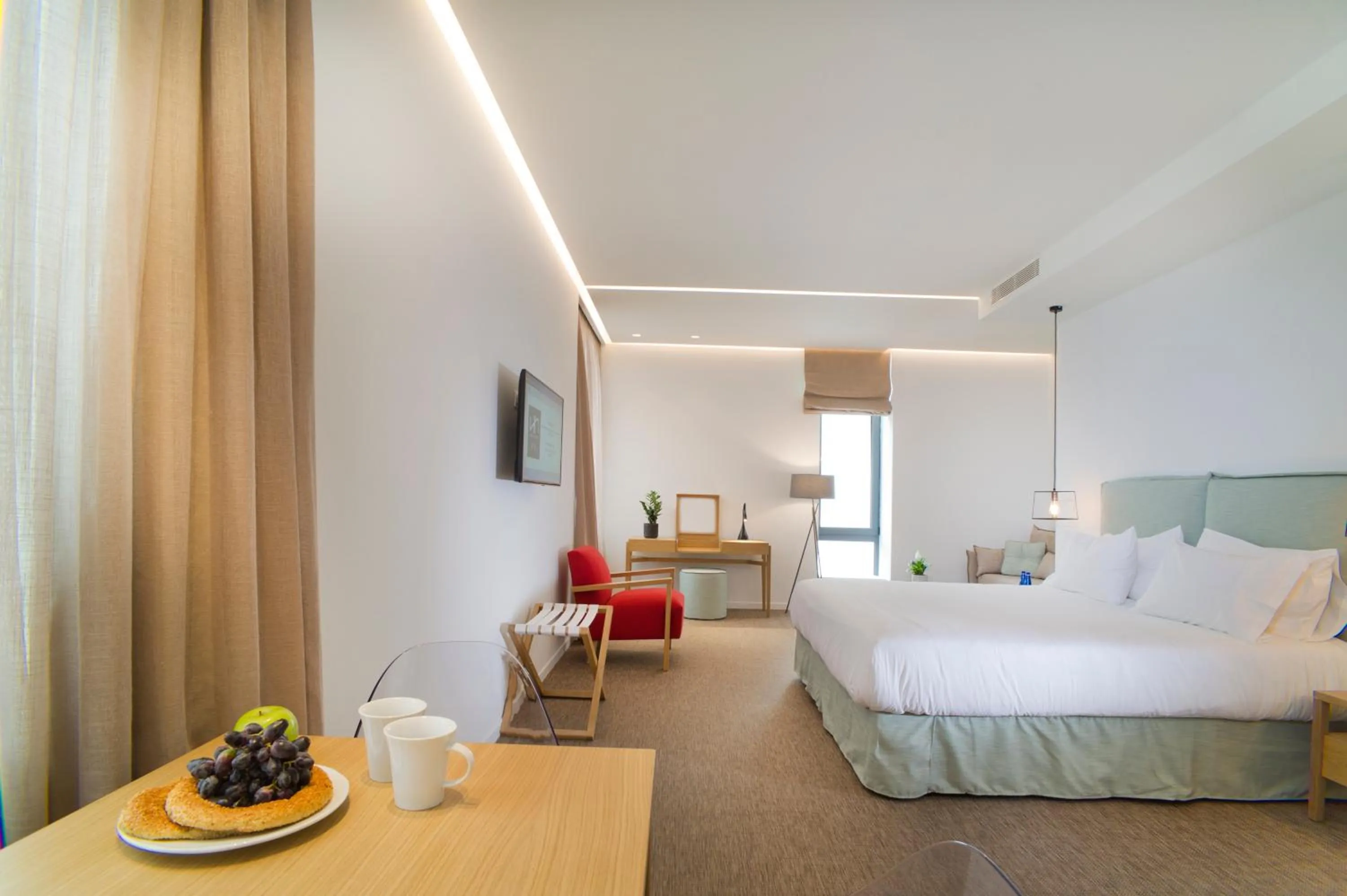 Seating area, Bed in NLH FIX | Neighborhood Lifestyle Hotels