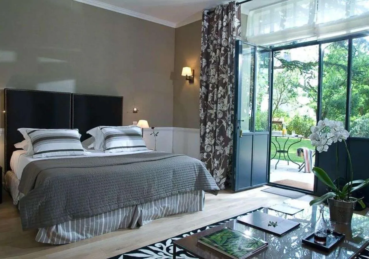 Patio, Bed in Domaine de la Tortinière