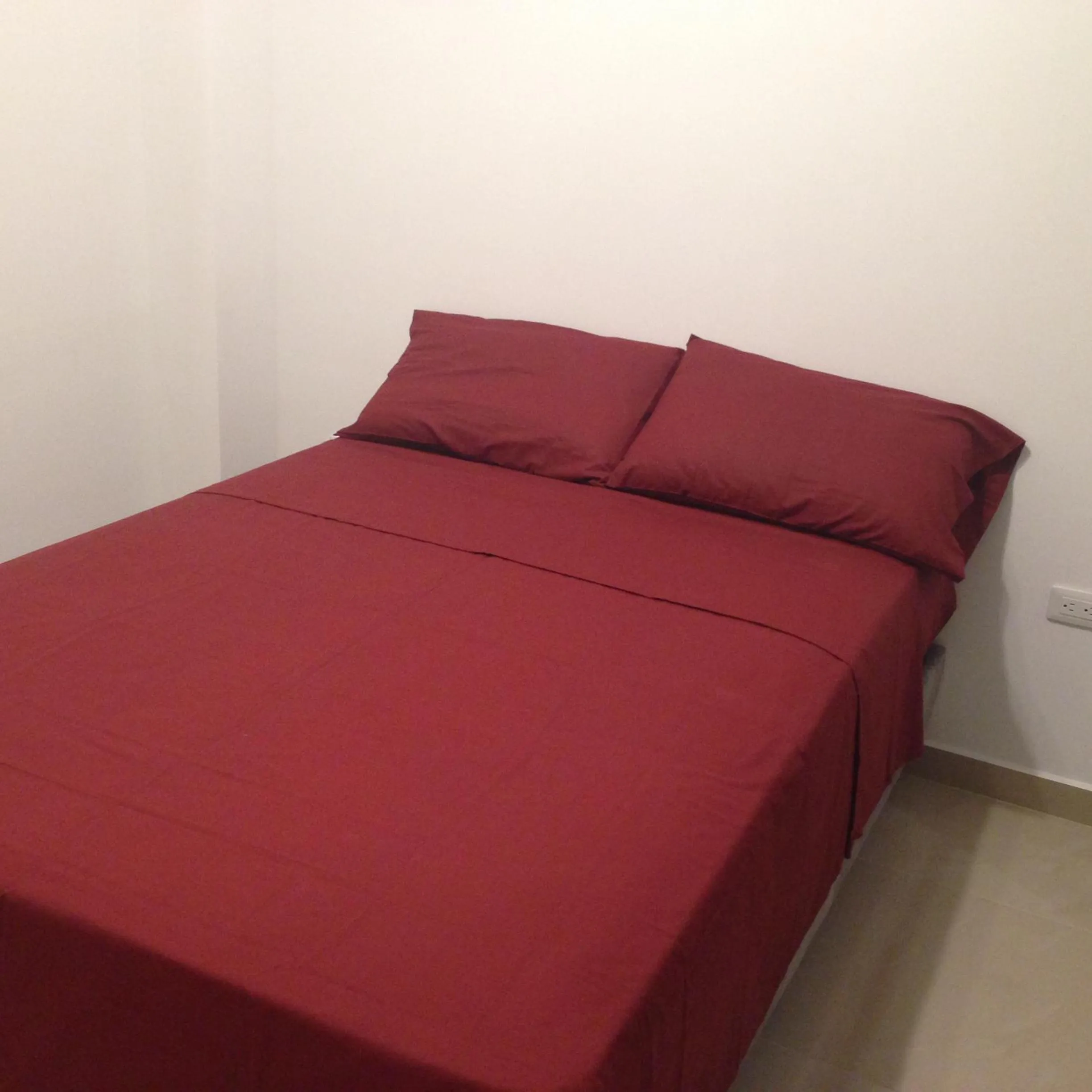 Bed in Hotel Almond Beach